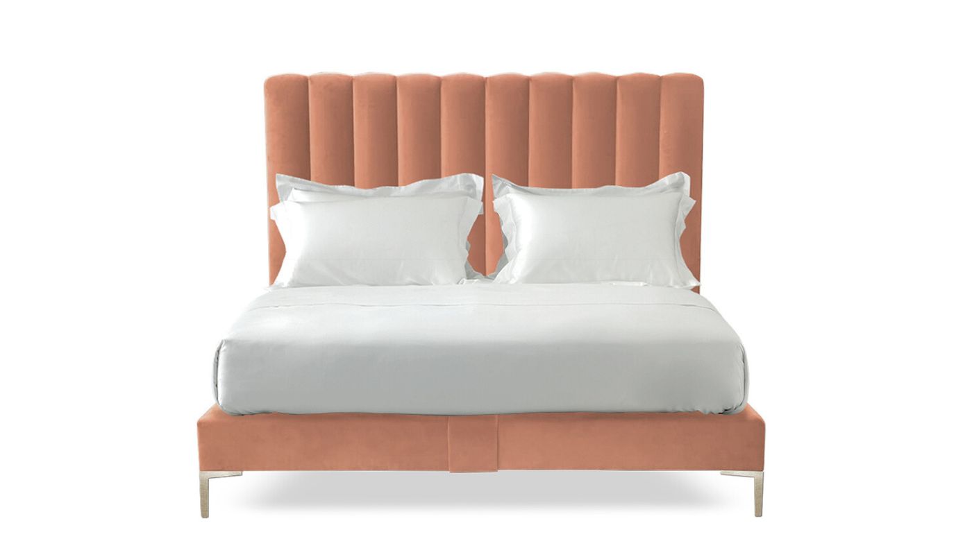 Undressed Hudson bed with a peach colour headboard and base featuring a mattress and cushions