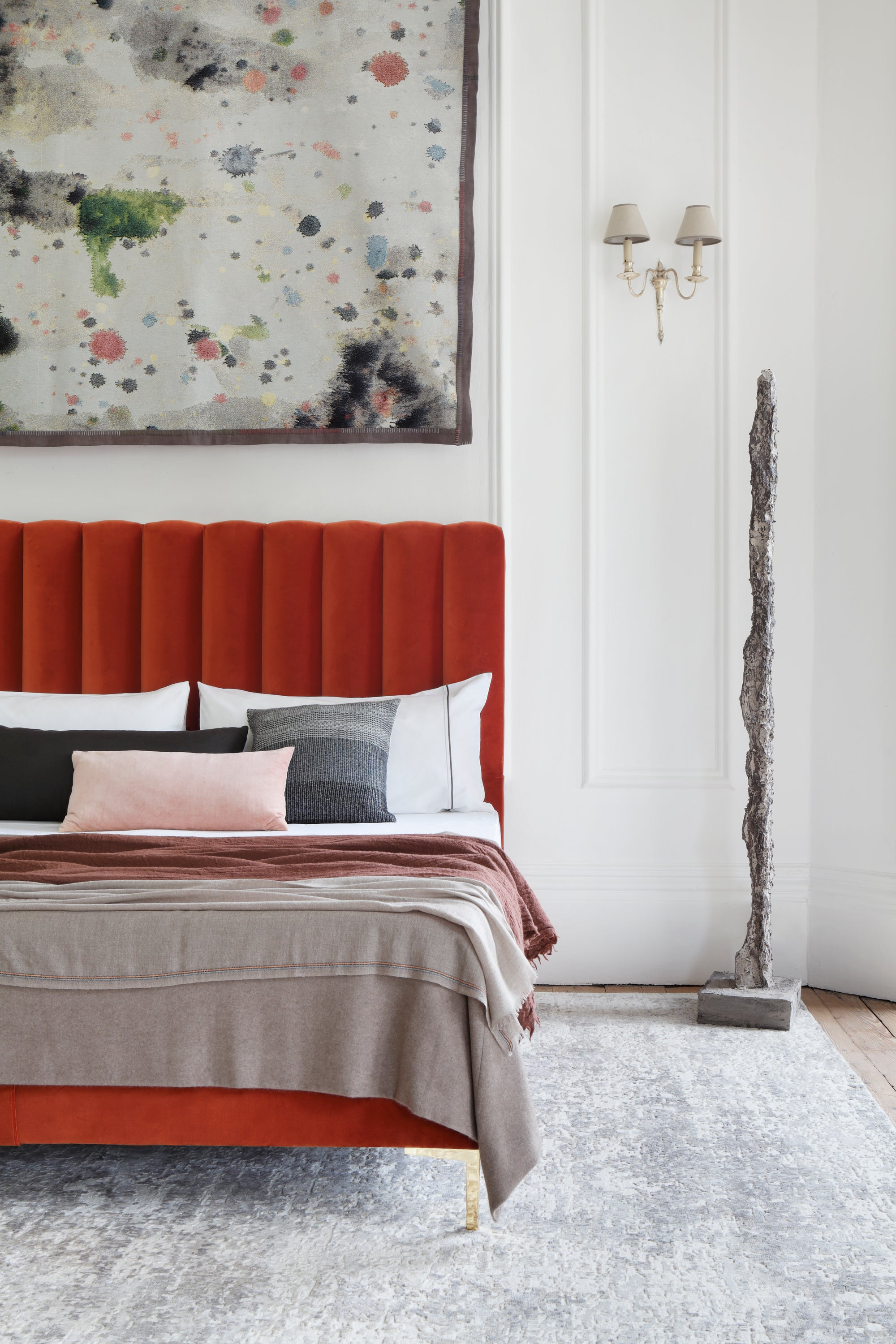 Savoir Hudson bed upholstered with a burnt orange headboard