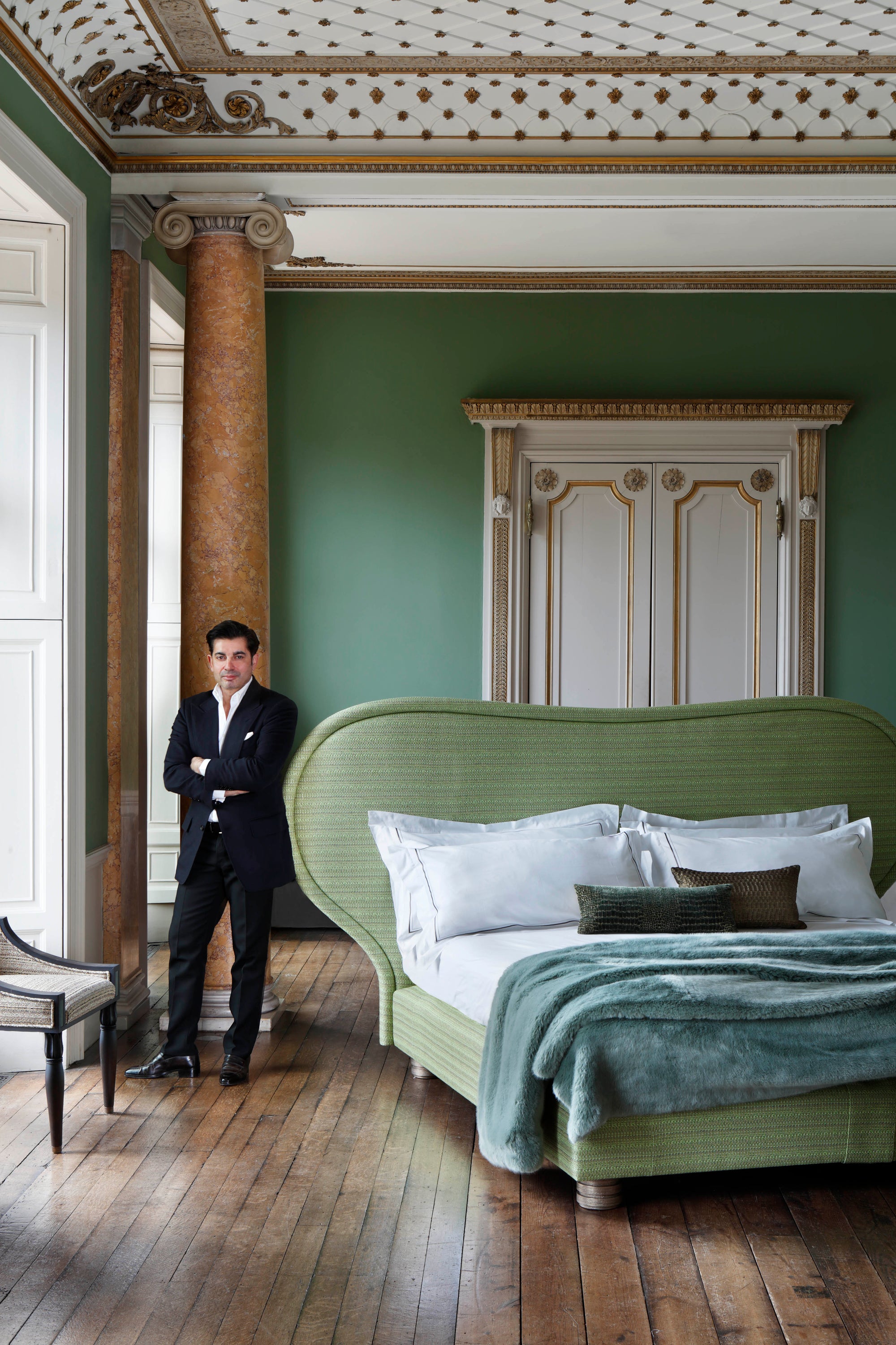 A life style portrait of the Louis bed with the designer Francis Sultana