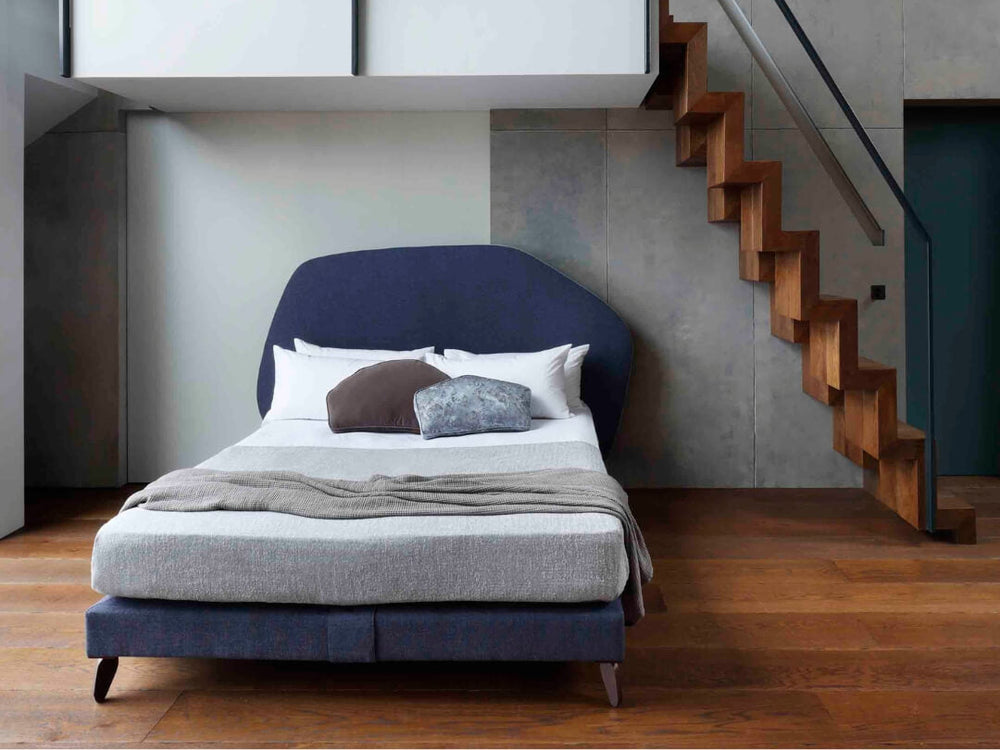 The Cloud design featuring textural blue upholstery and a cloud-shaped headboard
