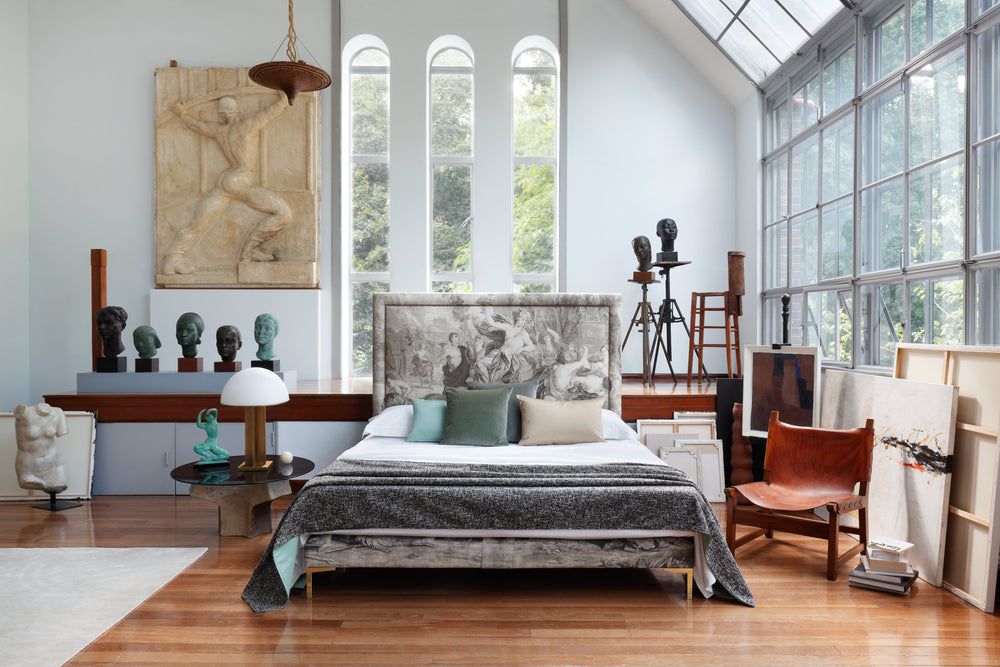 Renaissance-inspired Savoir Felix bed in a room with large windows