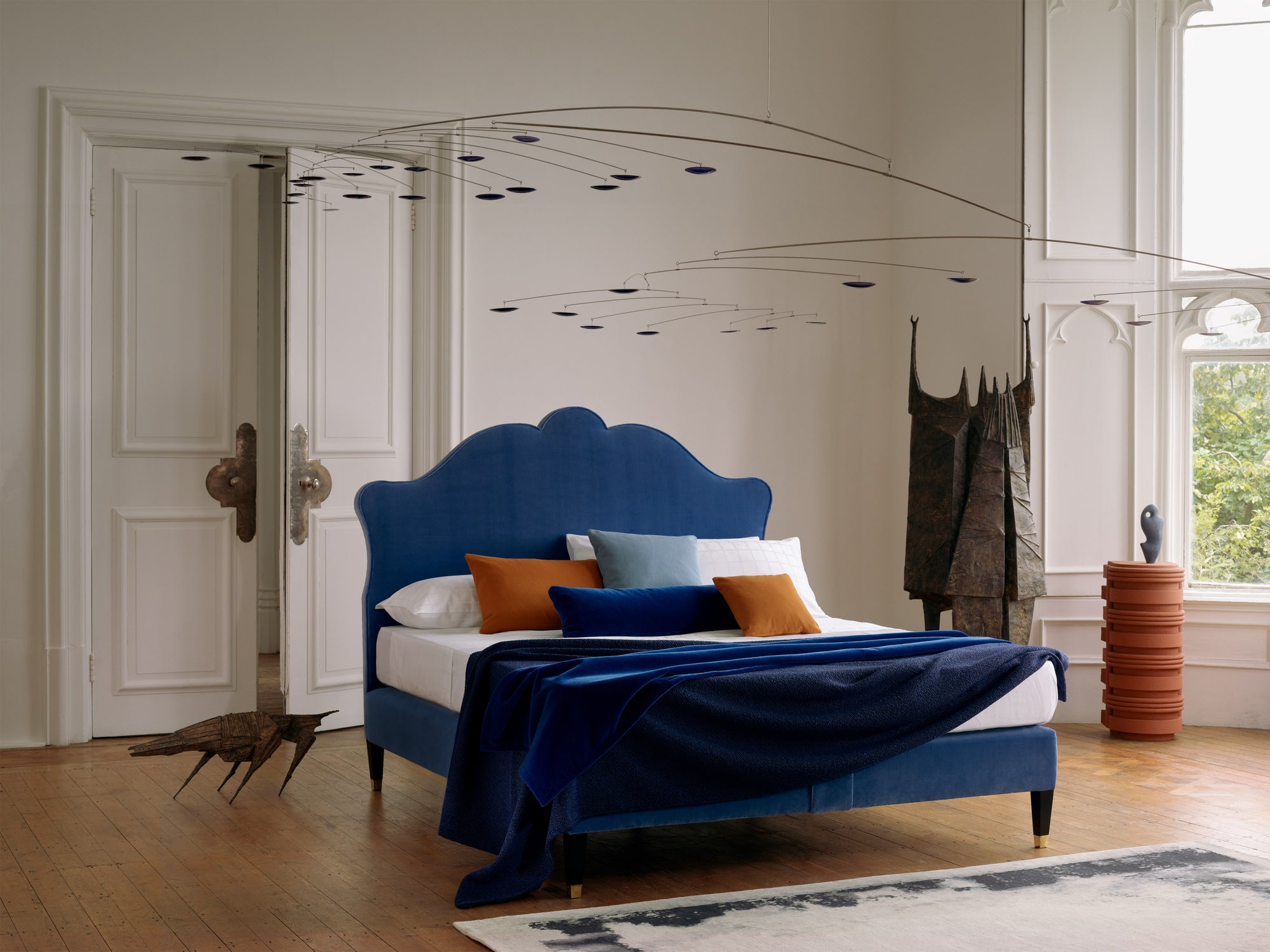 Savoir Lenoir bed with a gracefully curved headboard