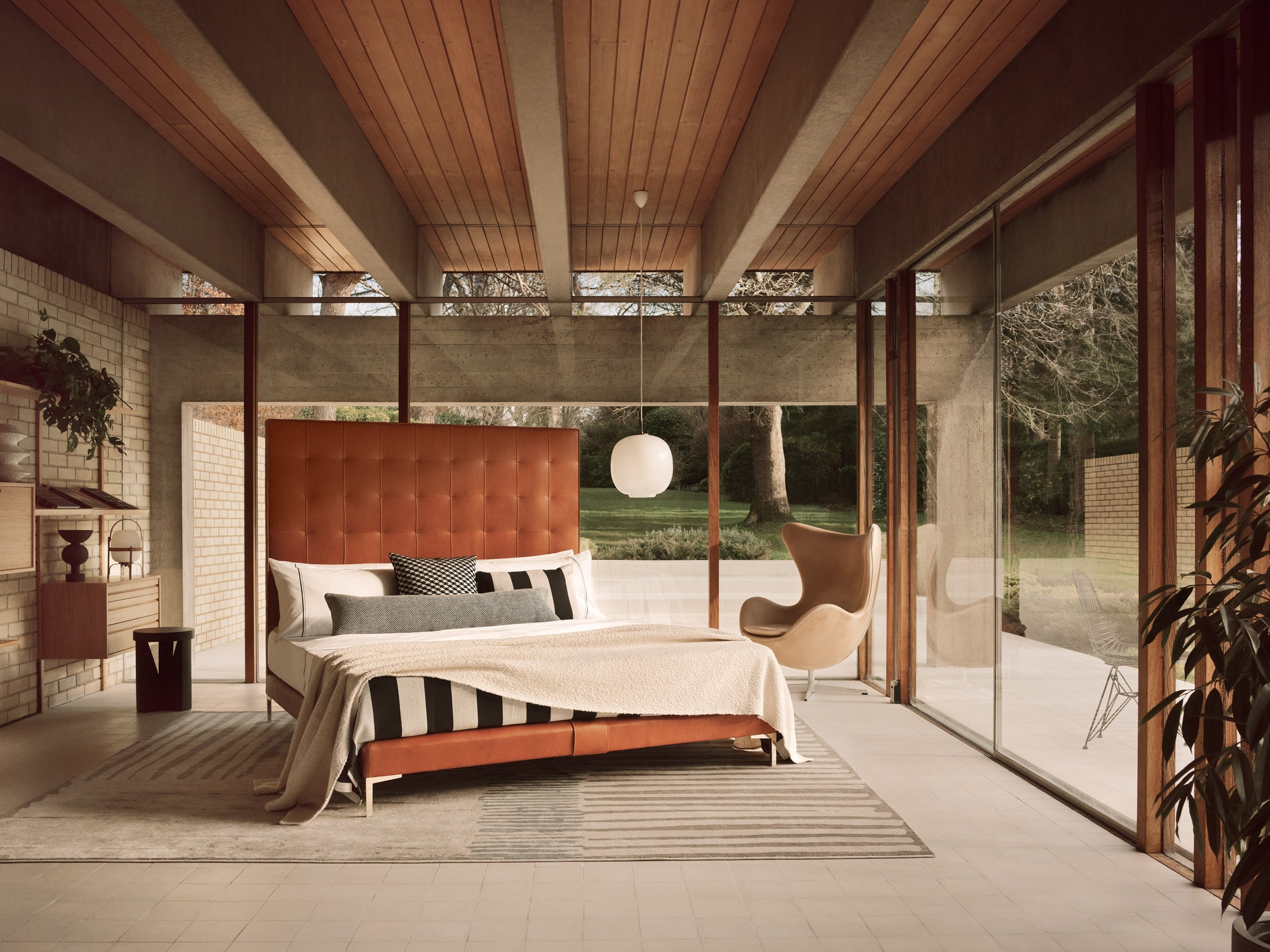 Savoir Winston bed completely dressed and set in a room