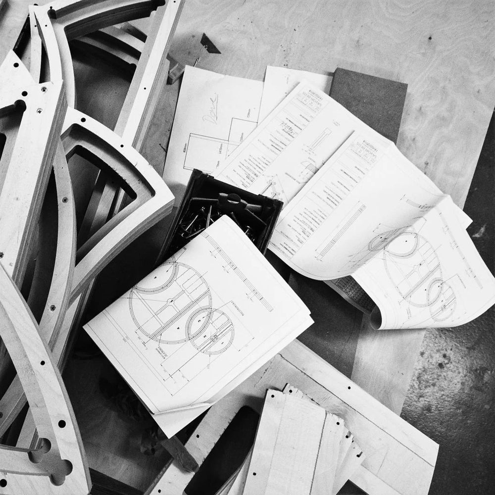 Different drawings on a wooden table