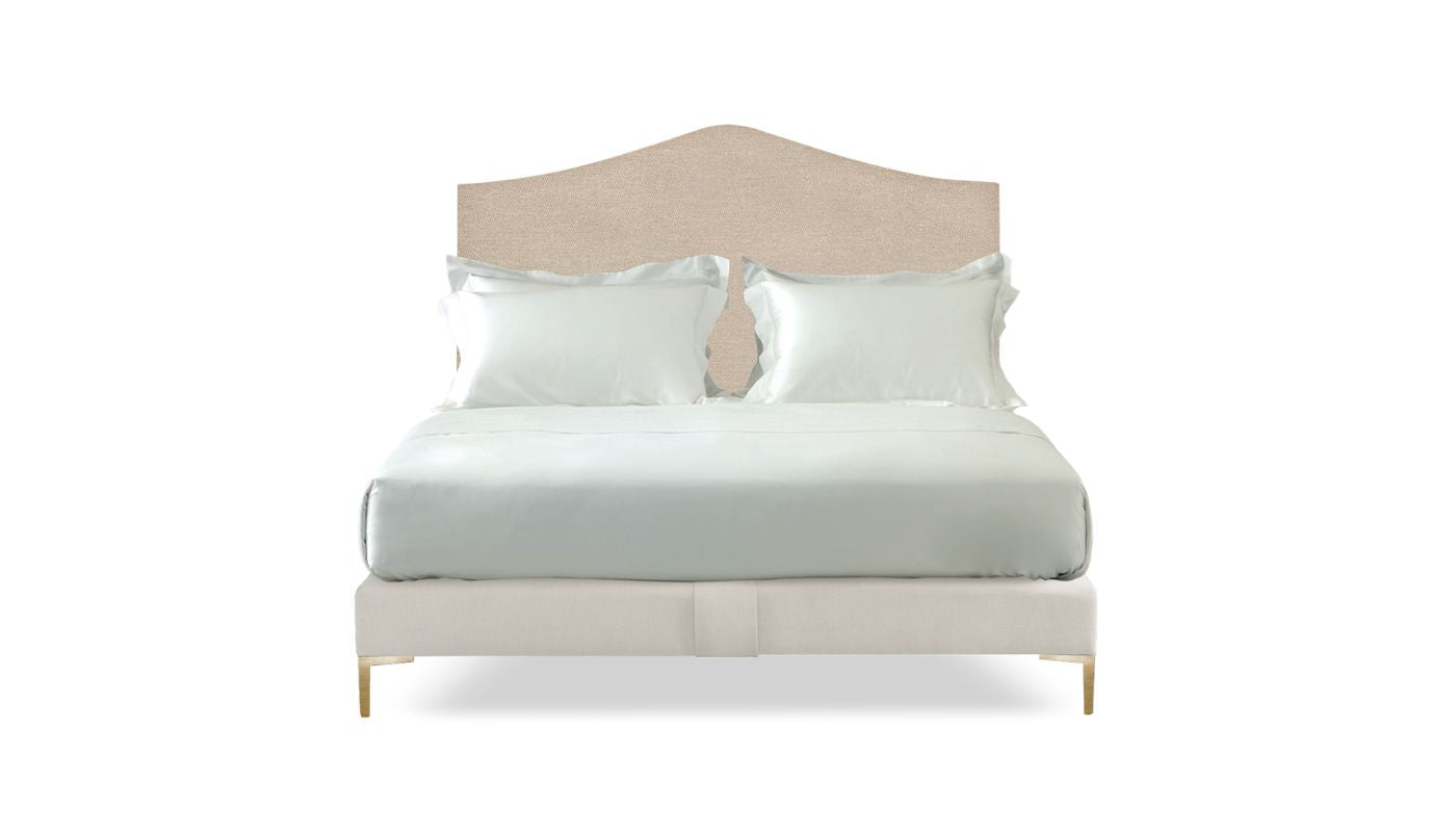 Undressed Alex bed with a cream fabric on headboard and base, featuring cushions