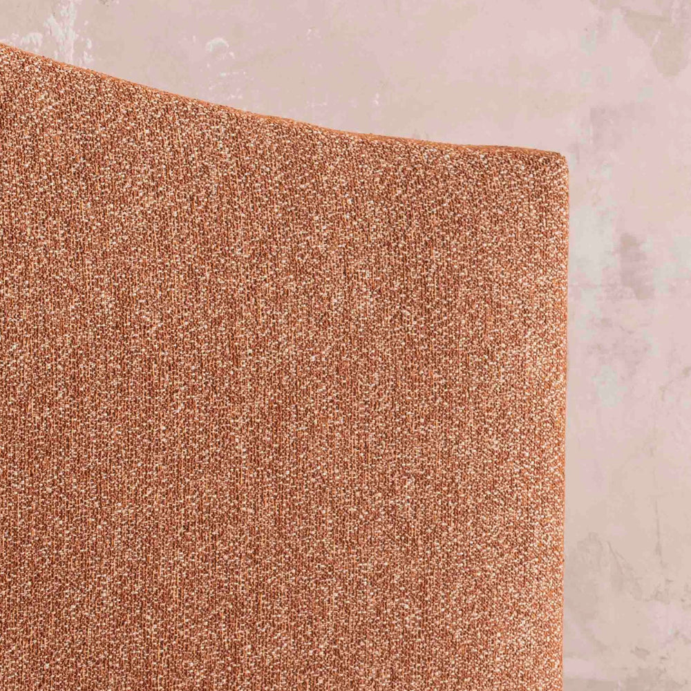 Close-up of the Savoir Alex headboard orange fabric