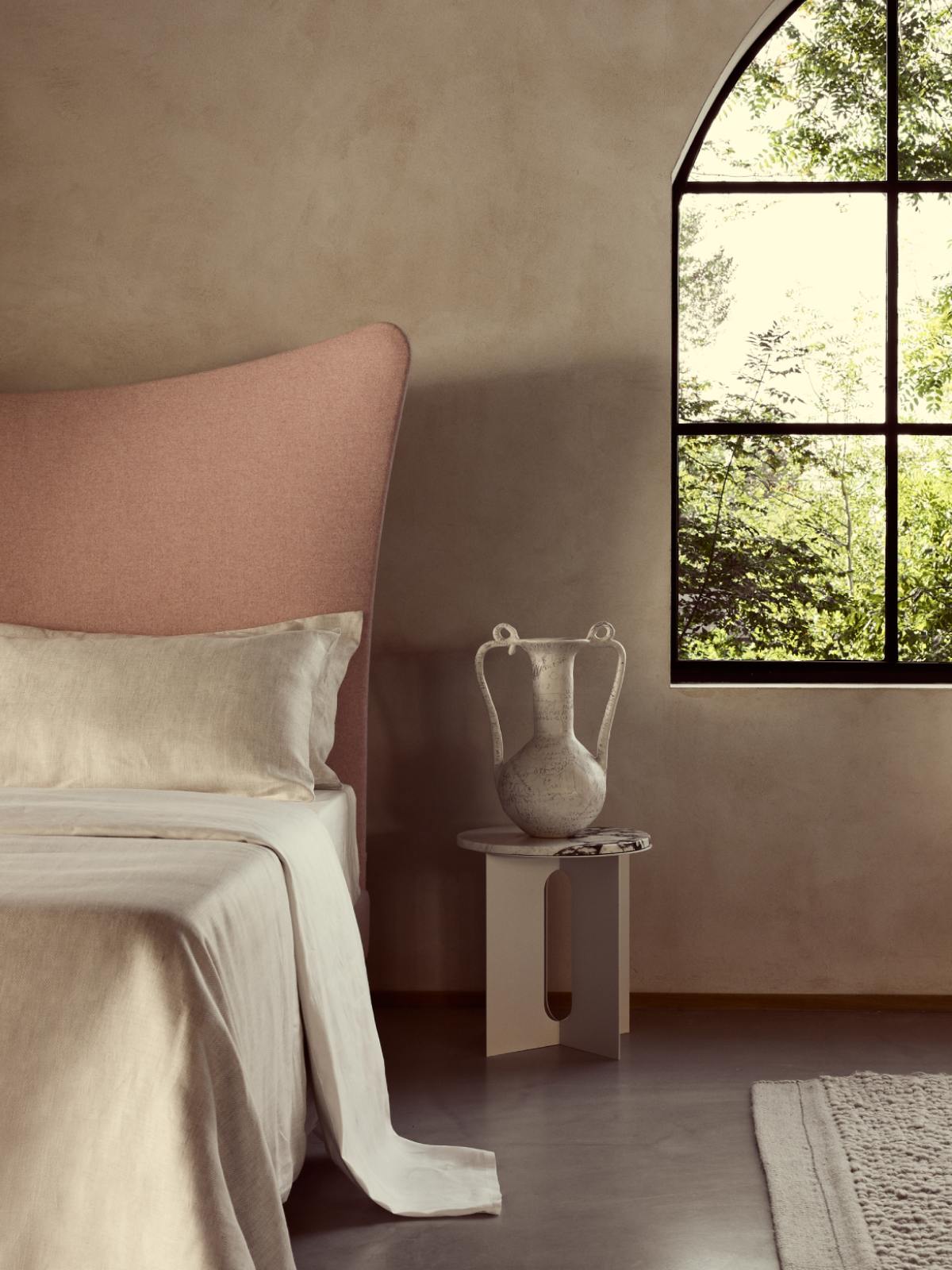 Luxurious and natural Herringbone bed sheets in light oatmeal colour photographed against a calming background.