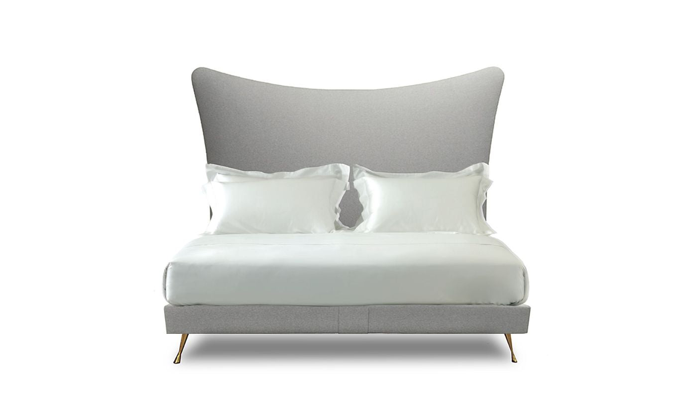 Undressed Amelia bed with a light grey fabric on headboard and base, featuring cushions