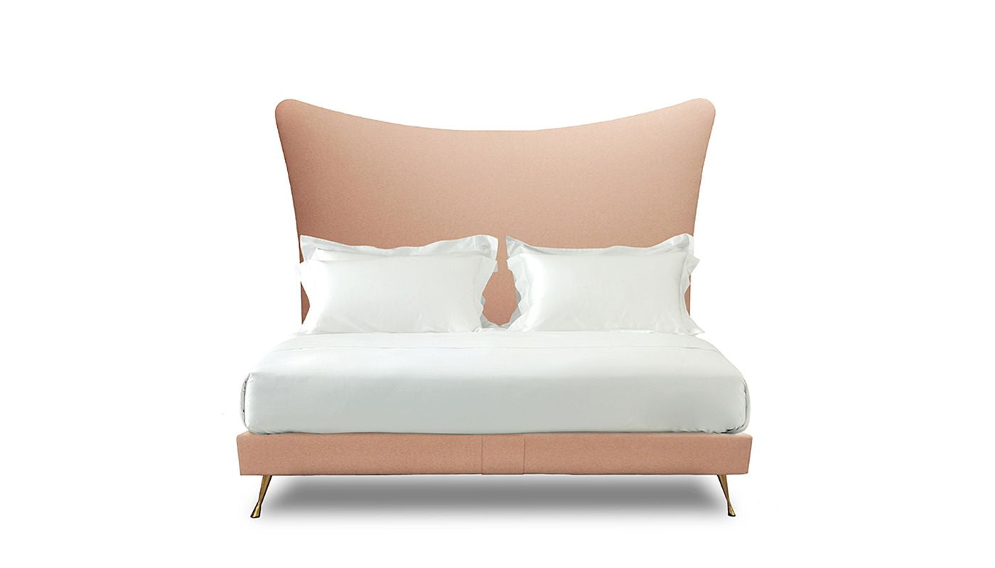 Undressed Amelia bed with a peach fabric on headboard and base, featuring cushions