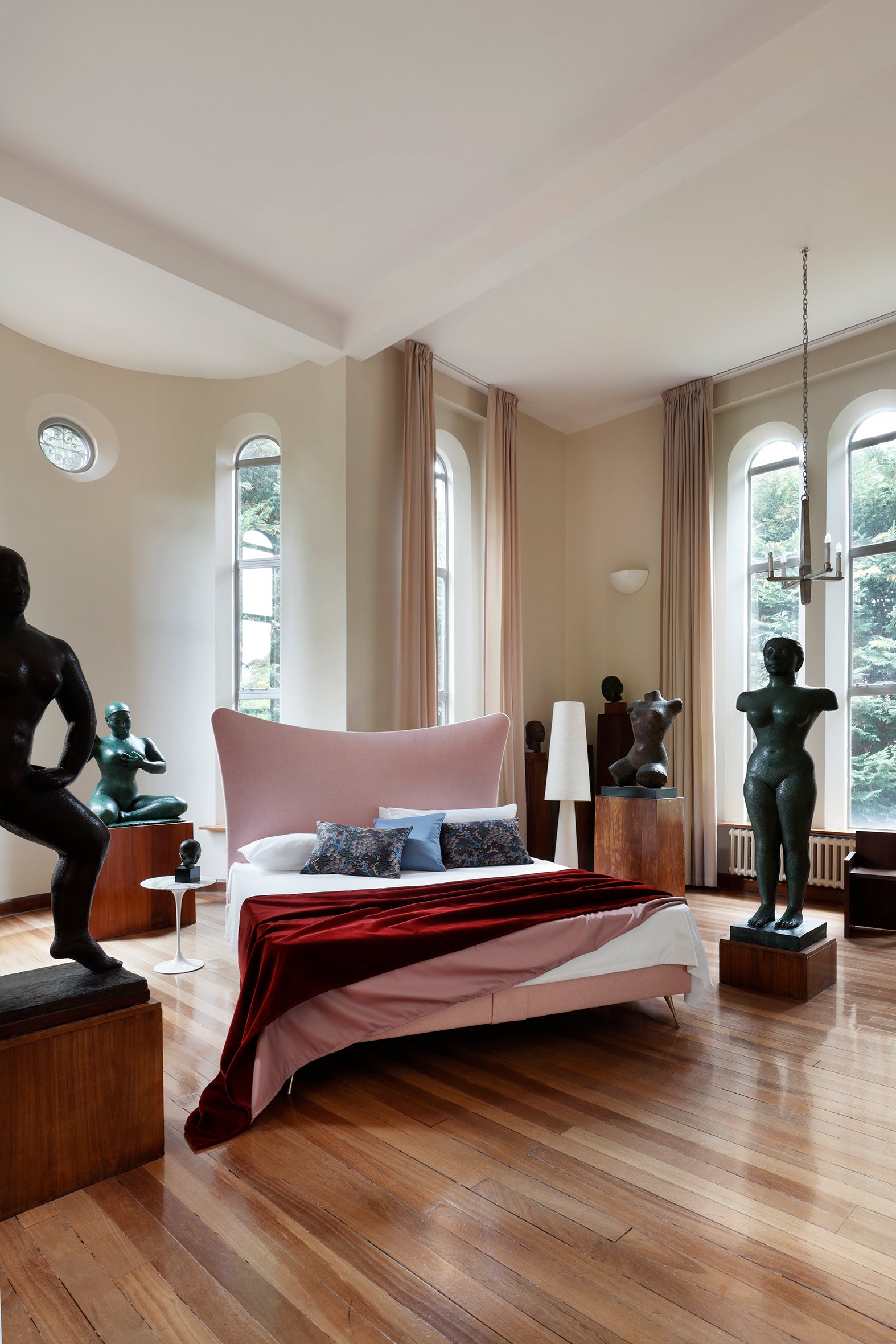 Amelia bed photographed amongst sculptures at Dorich House Museum