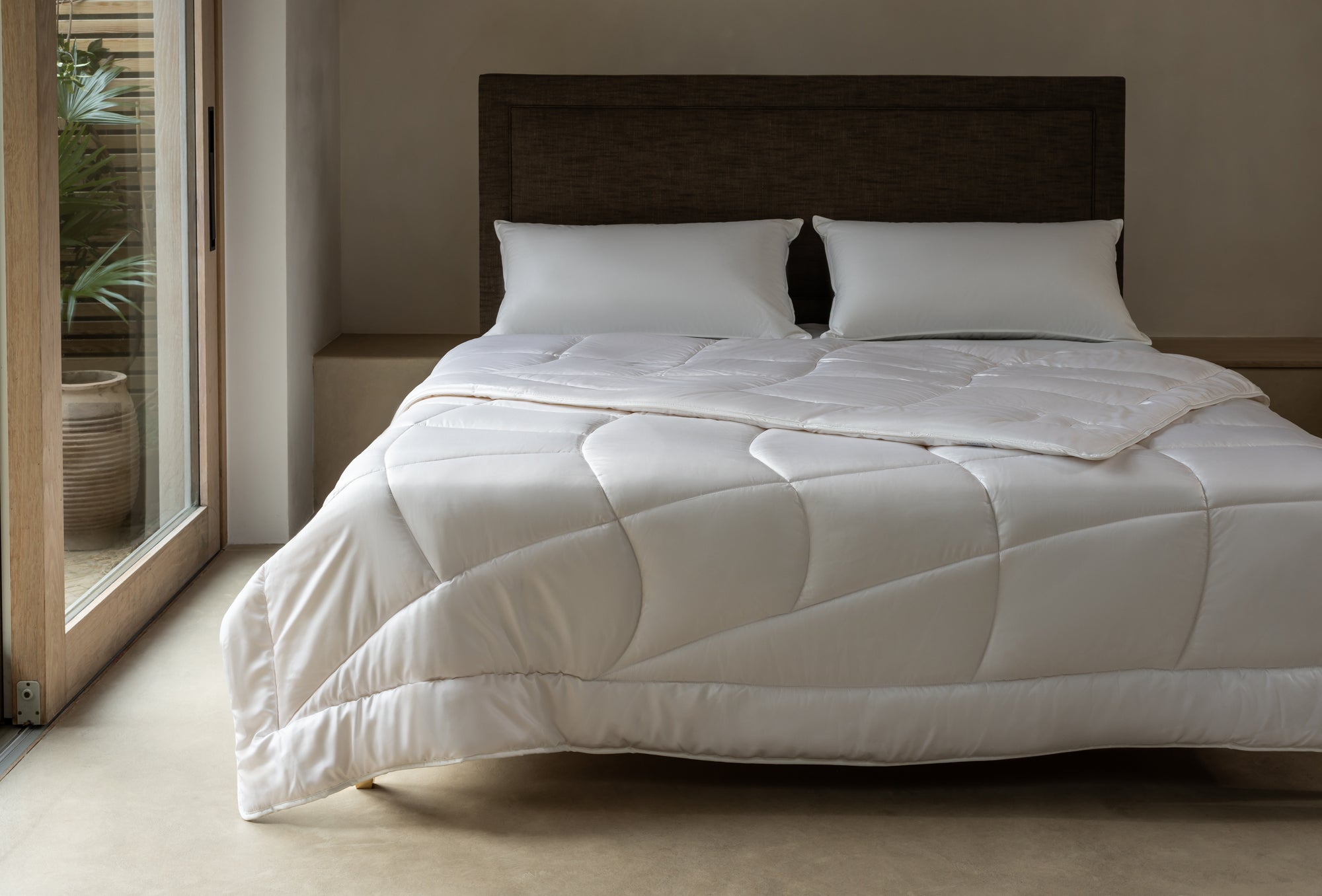 Savoir cashmere duvet folded over bed