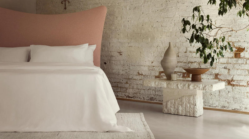 Natural materials with organic bed linens Photographed by Toby Mitchell.