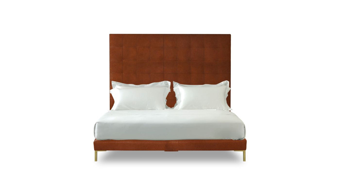 Undressed Winston bed with a marron colour headboard and base featuring a mattress and cushions