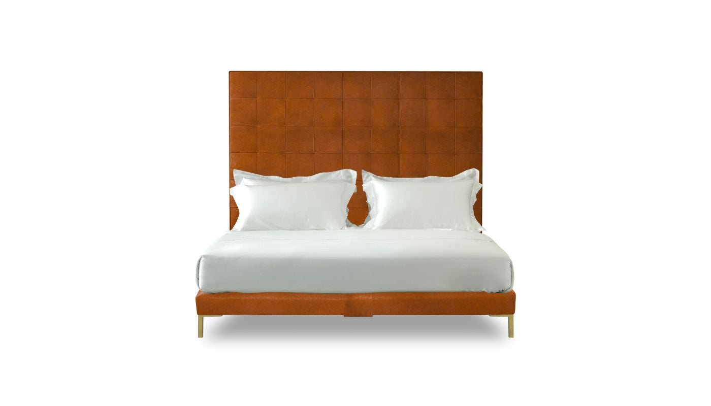Undressed Winston bed with a brick orange colour headboard and base featuring a mattress and cushions