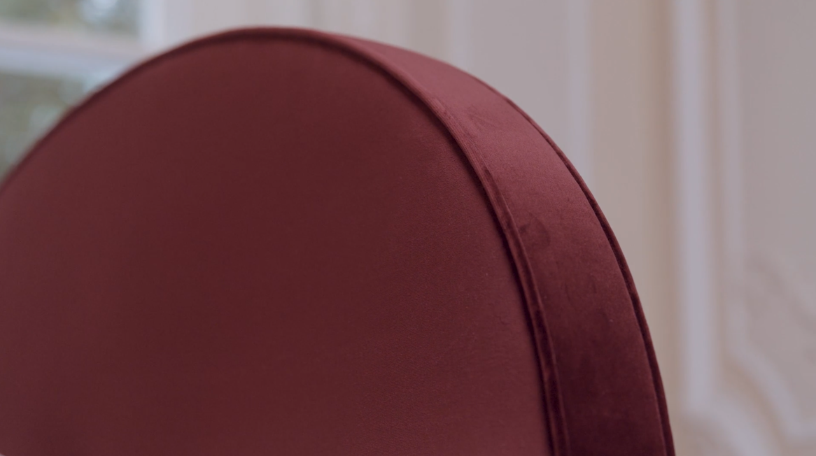 Close-up detail of our Elly headboard upholstered by hand for a unique finish