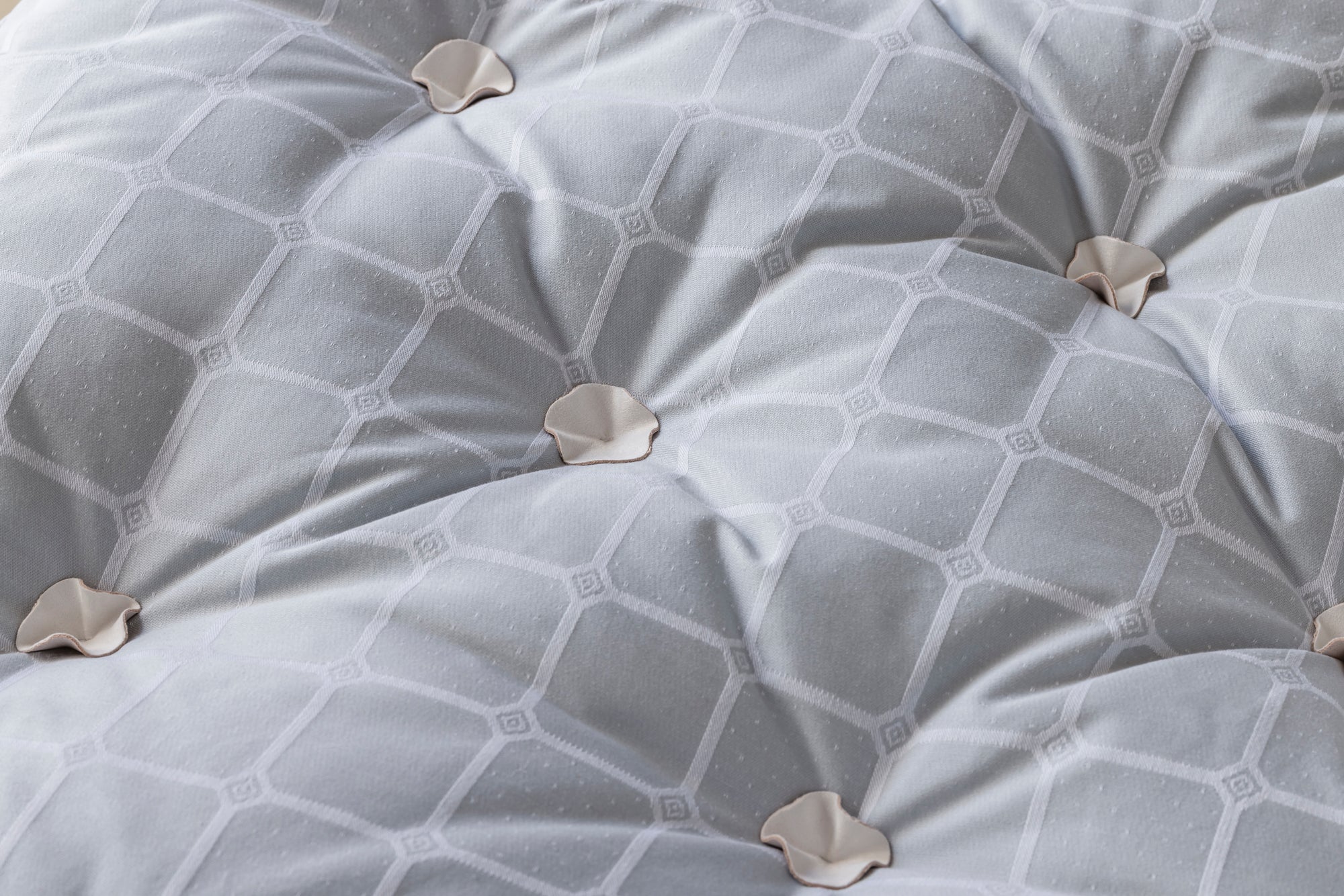 Detail of Savoir HC Topper leather tufting petals