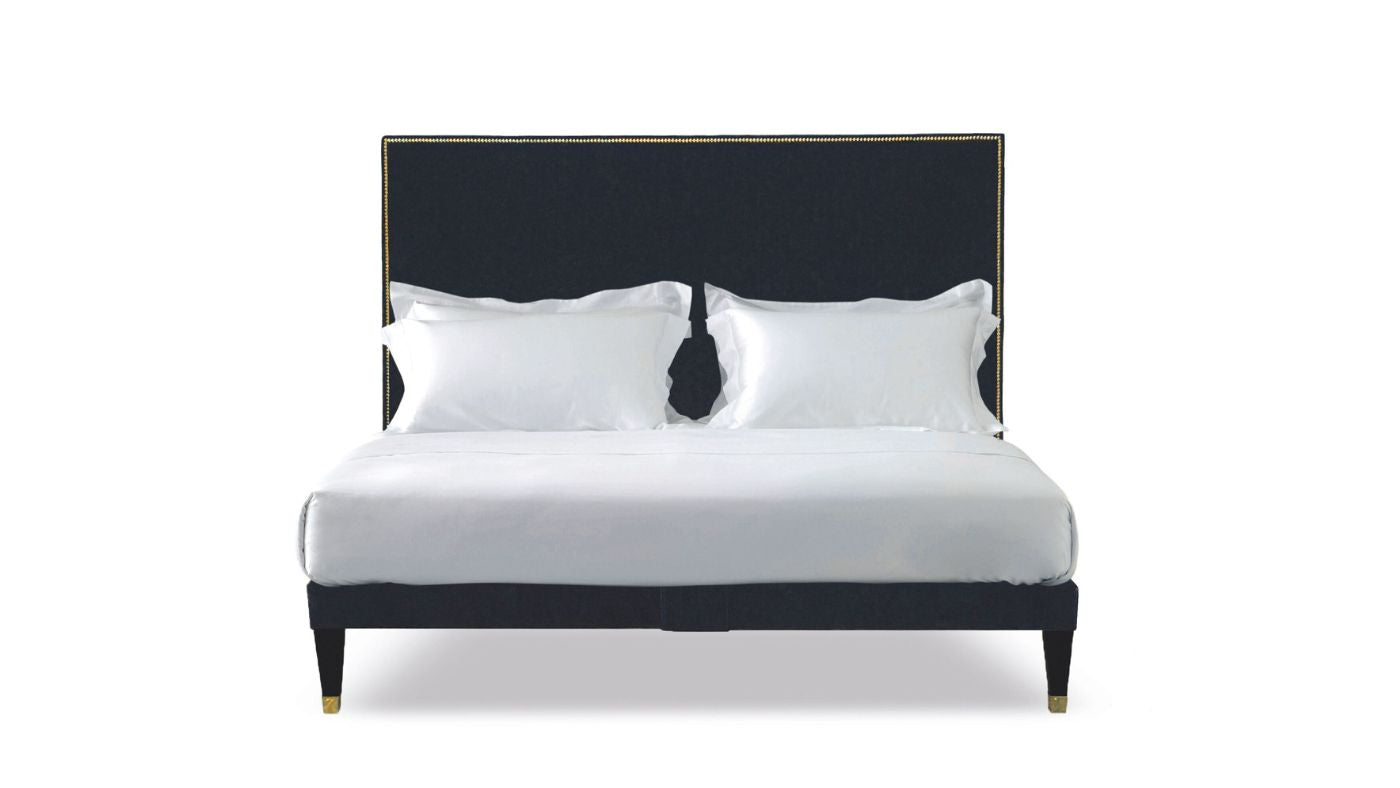Undressed Harlech bed with nailed edges and midnight blue headboard and base