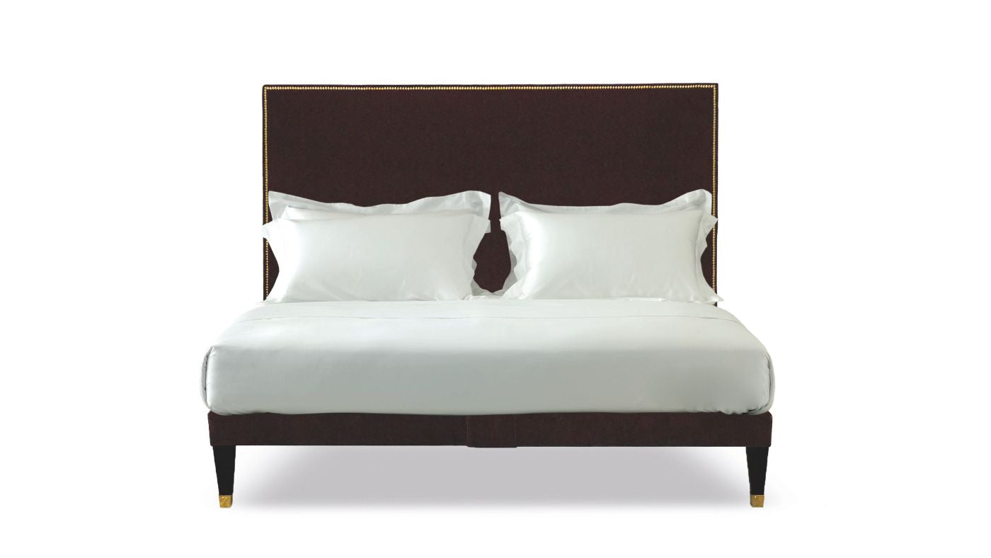 Undressed Harlech bed with nailed edges and marron headboard and base