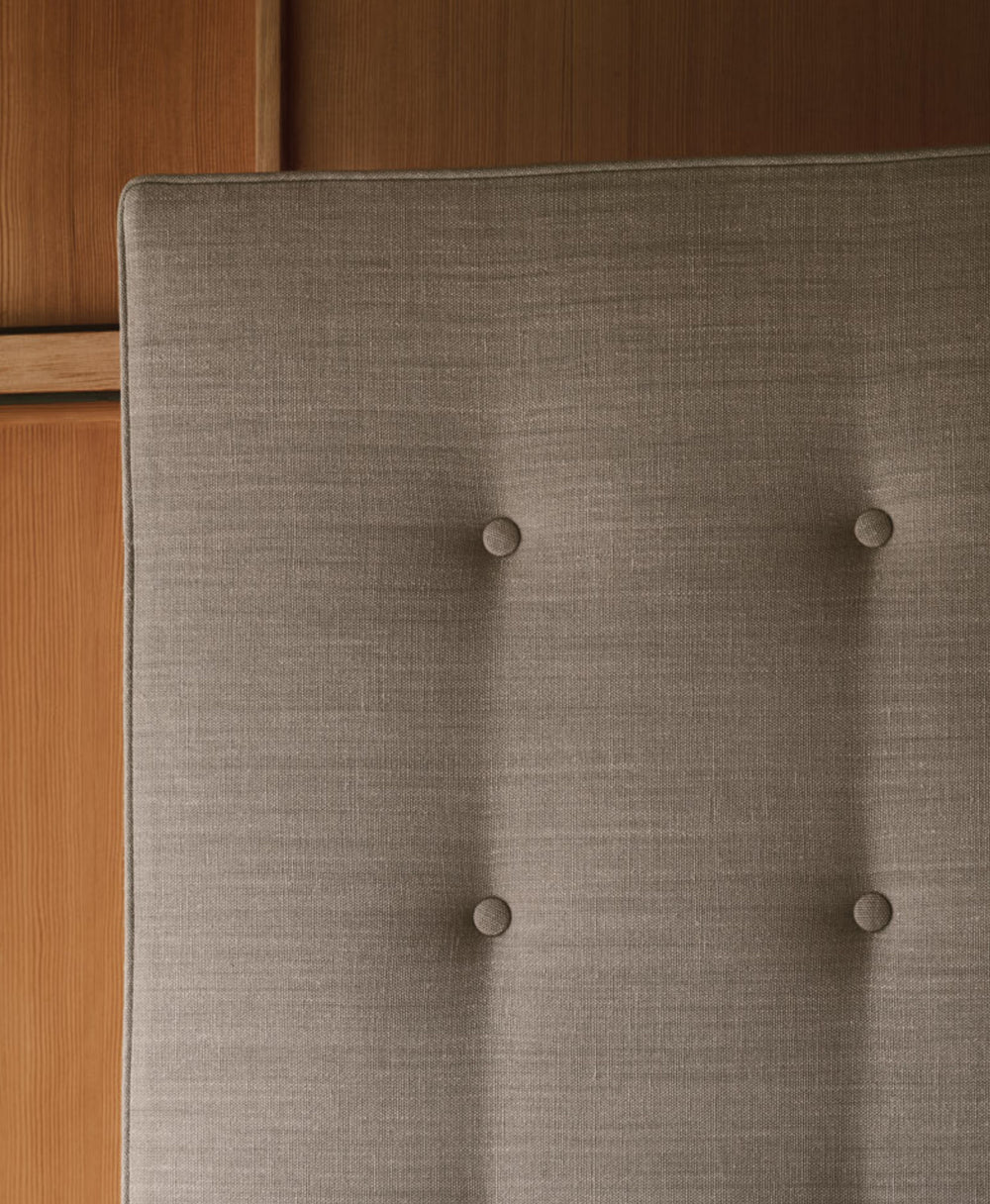 Close-up of our Savoir Holly bed with the buttoning detail.