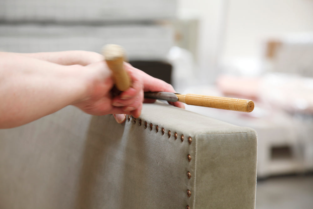 A close-up of the nailing technique with a craftsman