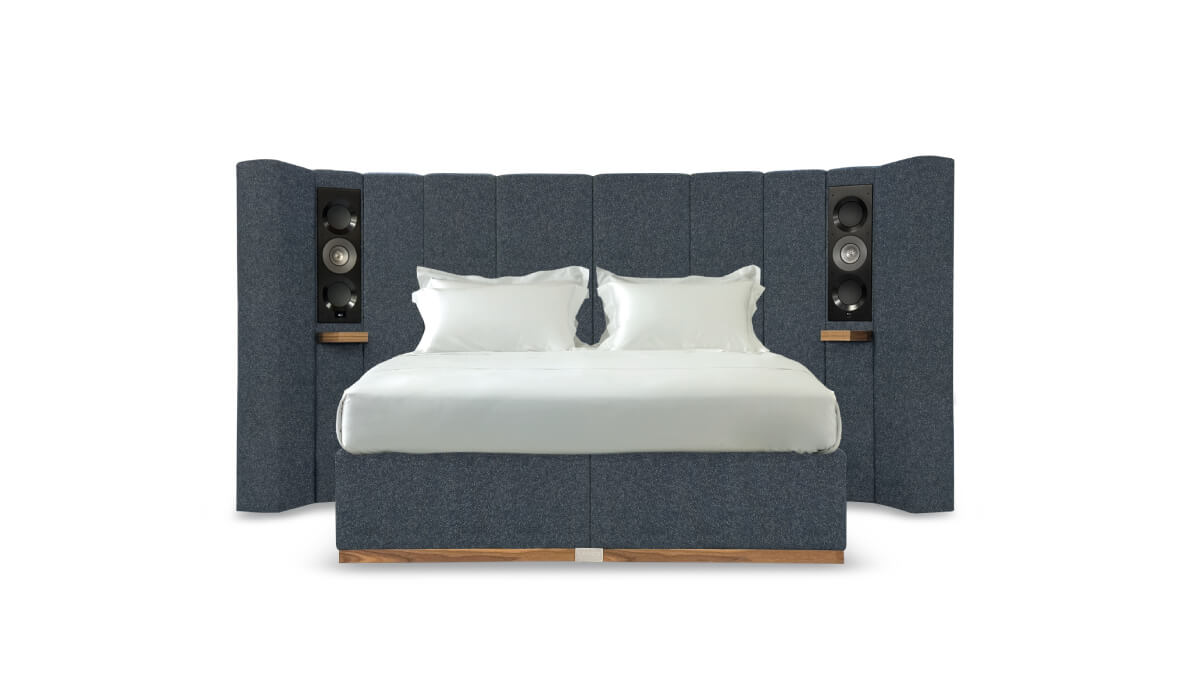 The Seventy Five bed upholstered in textured blue fabric.
