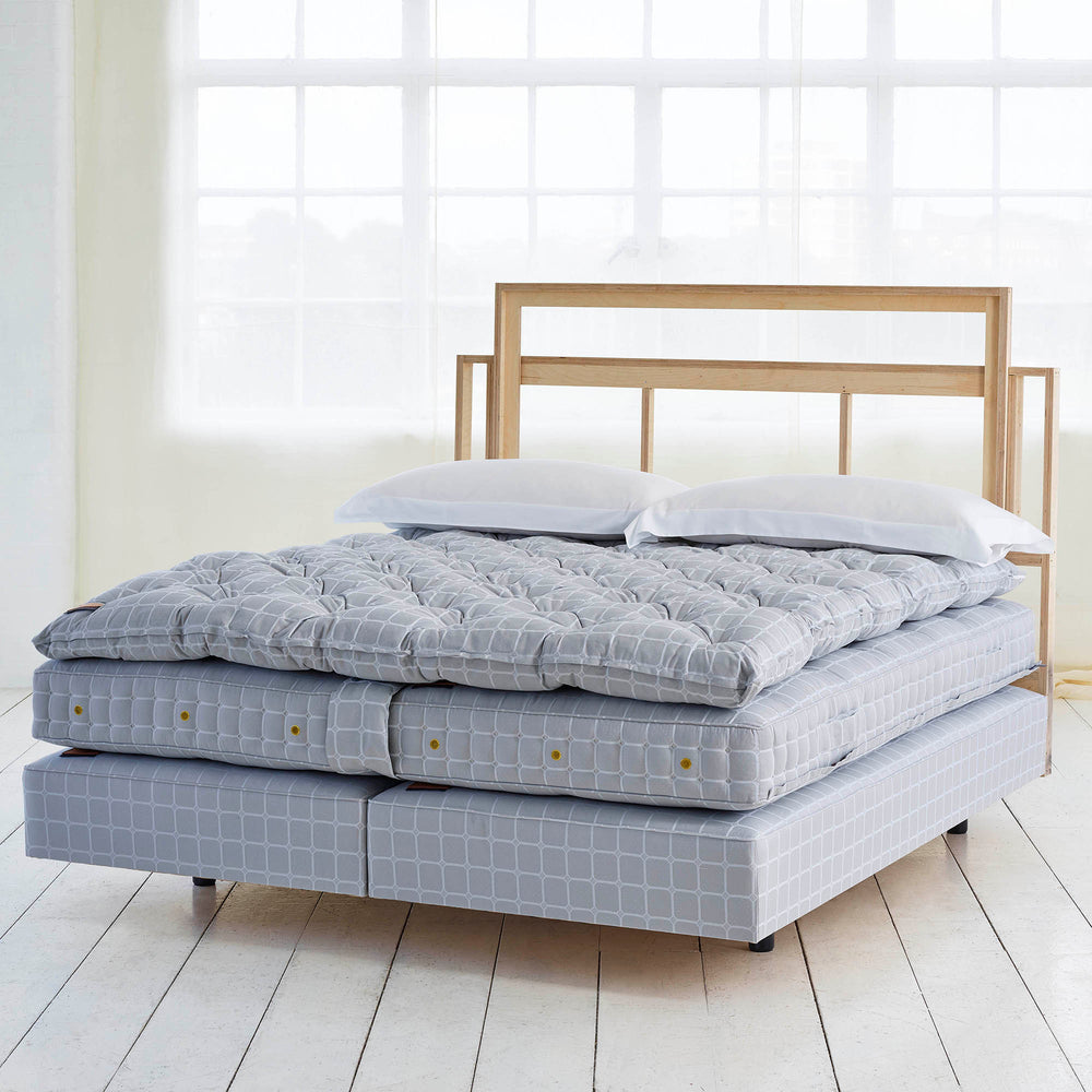 Savoir bed featuring the bed set no2 with the mattress, the base and the topper.