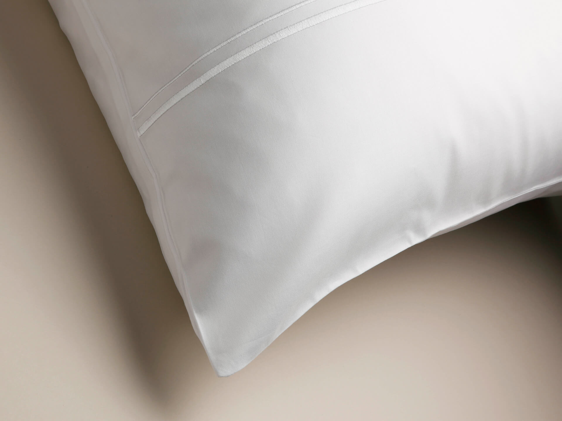 View from an angle of white corded pillowcase
