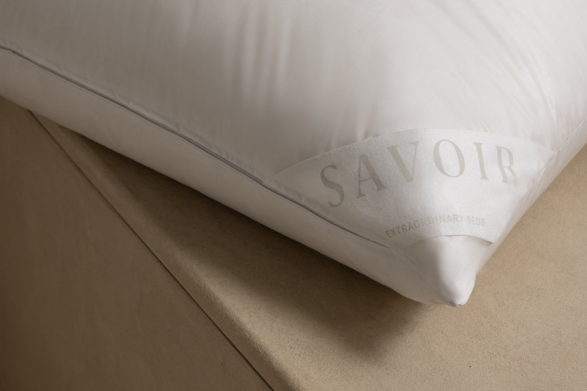 Savoir label in corner of a pillow