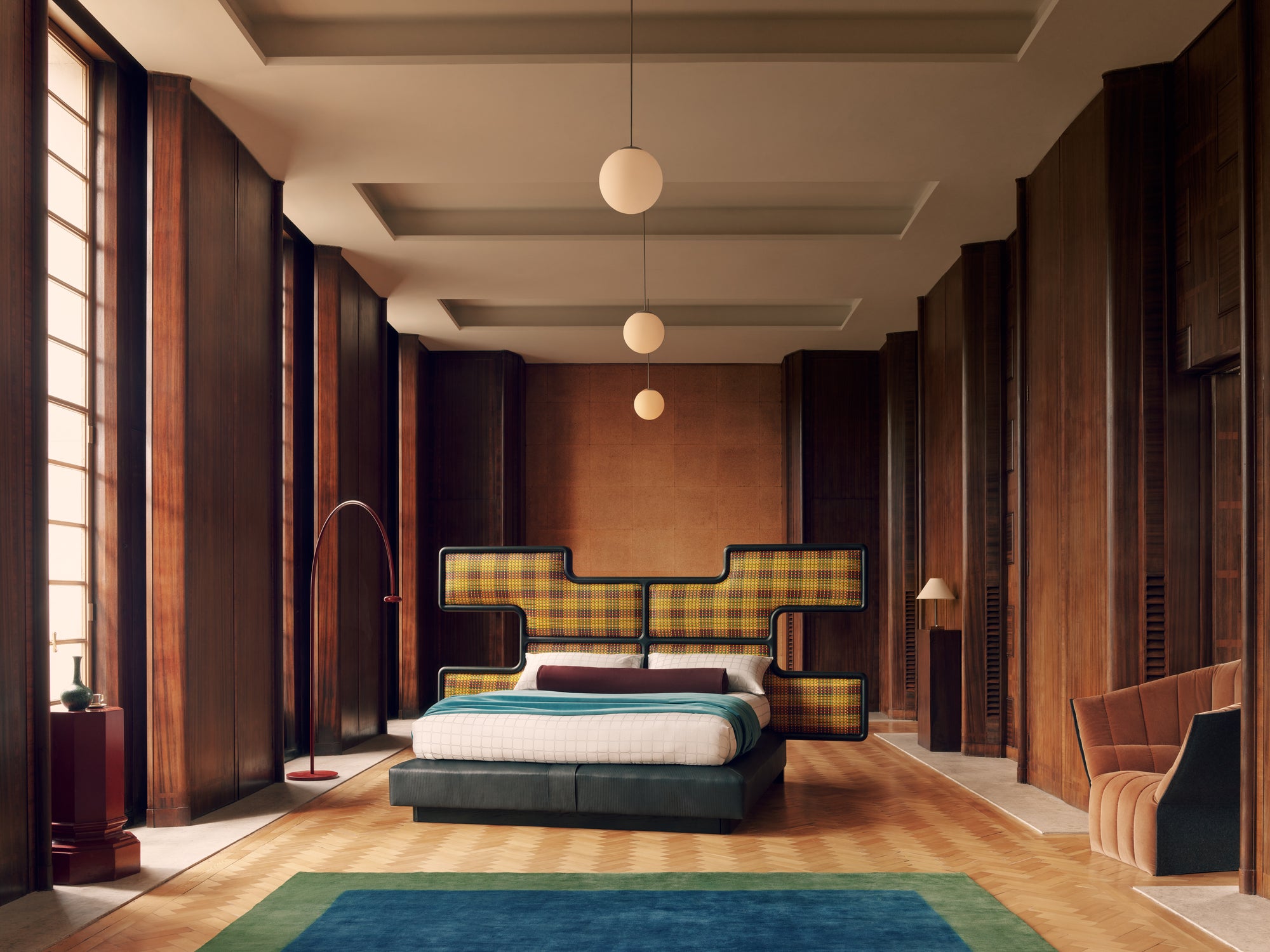 Modern bedroom with checkered headboard and wooden walls