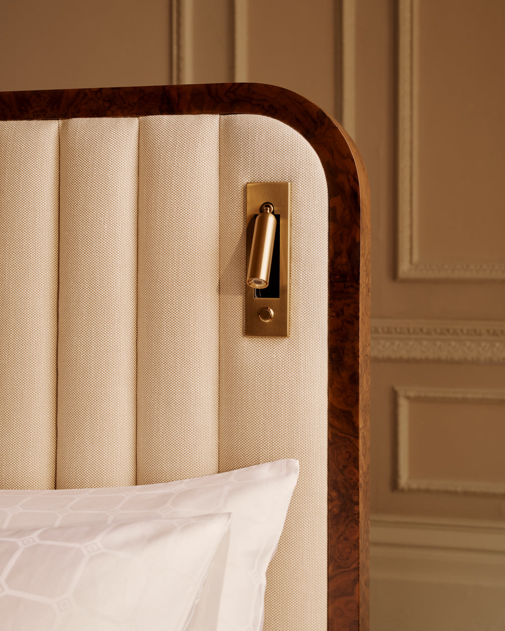 Close-up of brushed brass finish are integrated into the headboard