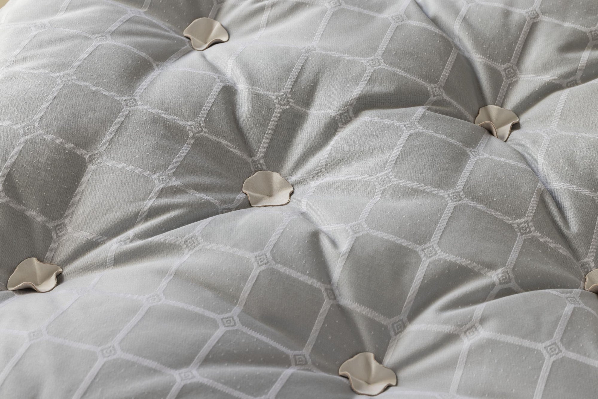 Close-up of Savoir trellis topper with geometric pattern