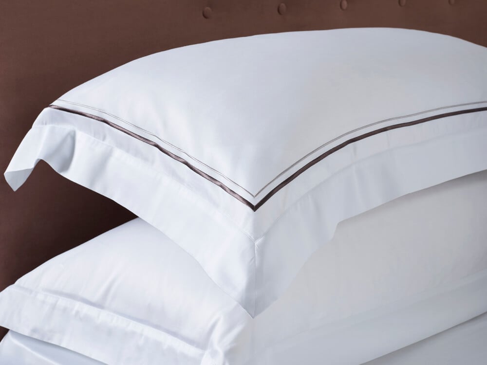 Penelope bed showcasing two sateen pillowcases