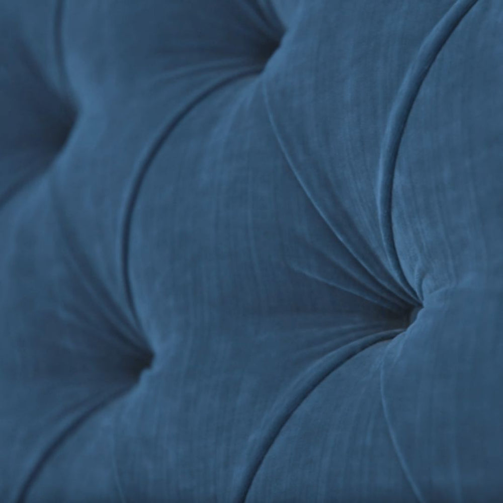 Close view of the deep buttoning on the State bed