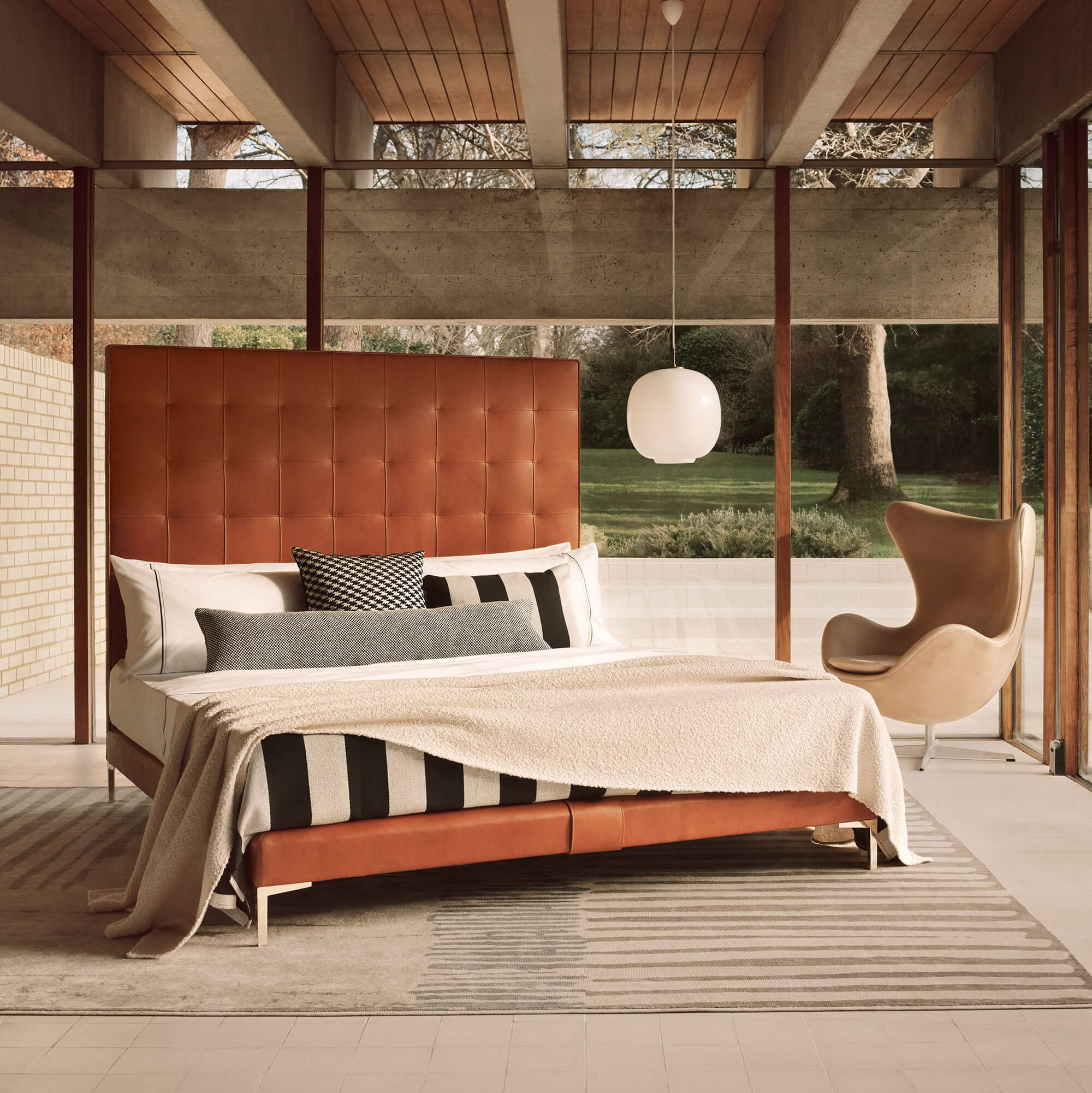 Savoir Winston bed completely dressed and set in a room