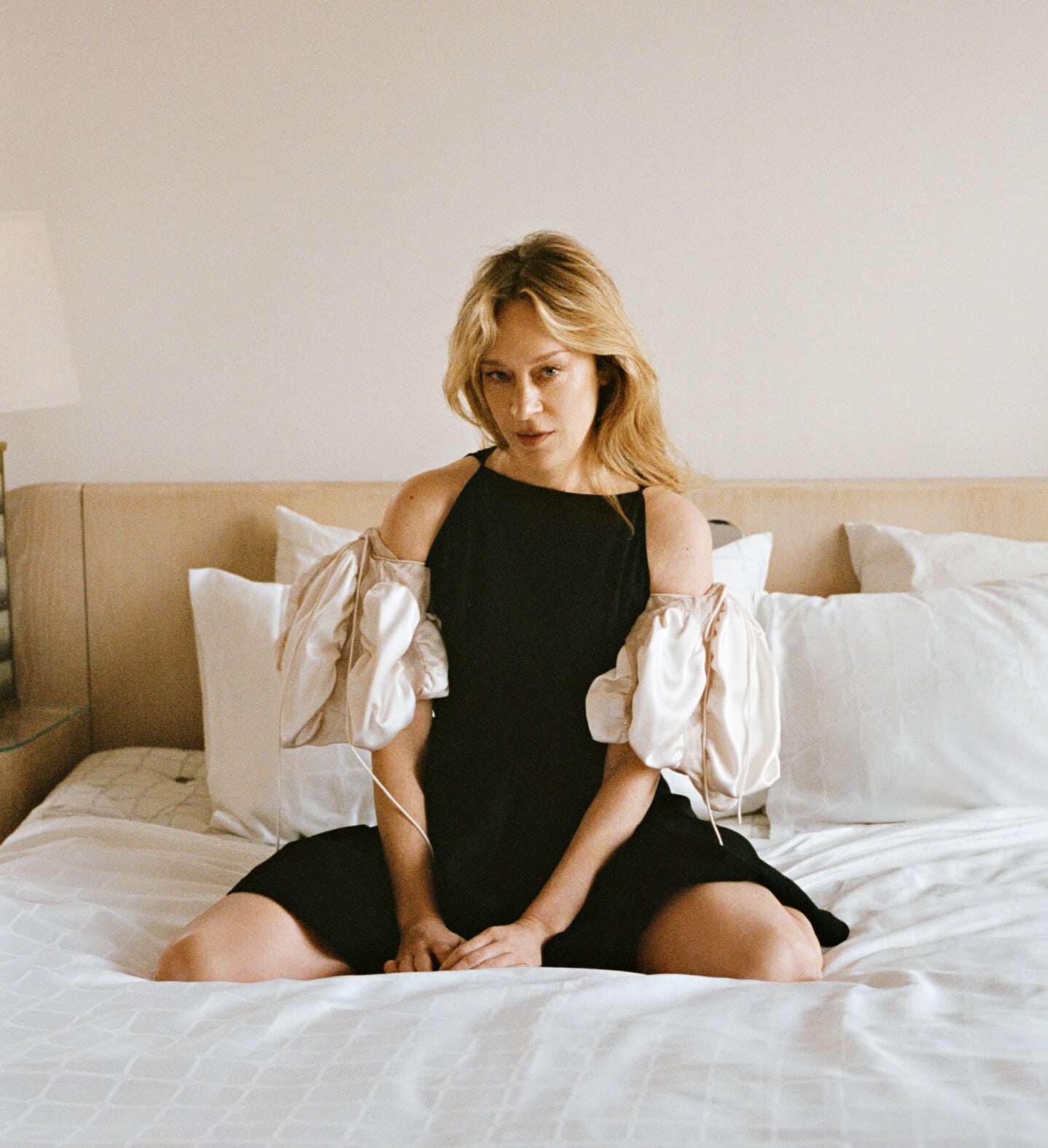 Chloë Sevigny sitting on a No.4 Bed Set
