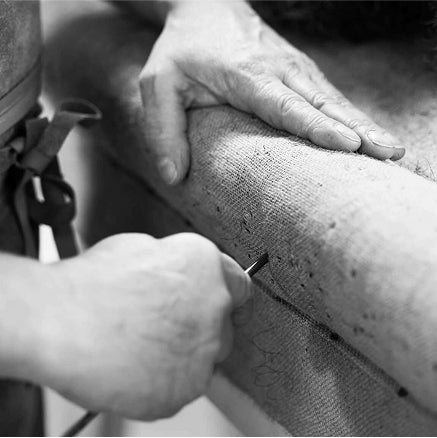 A Savoir craftsman working on a base