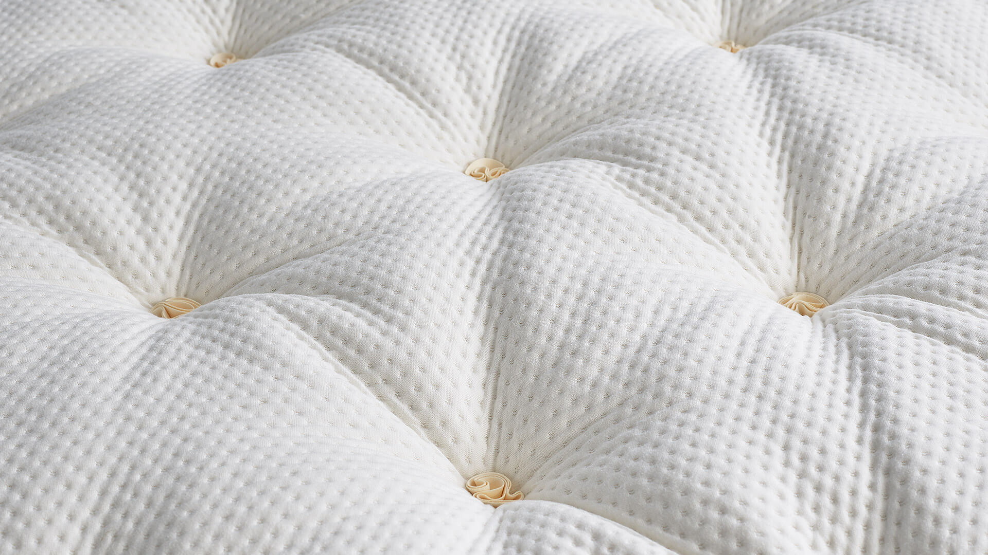 Close up of the detail of luxurious cashmere and horse tail Savoir bed topper