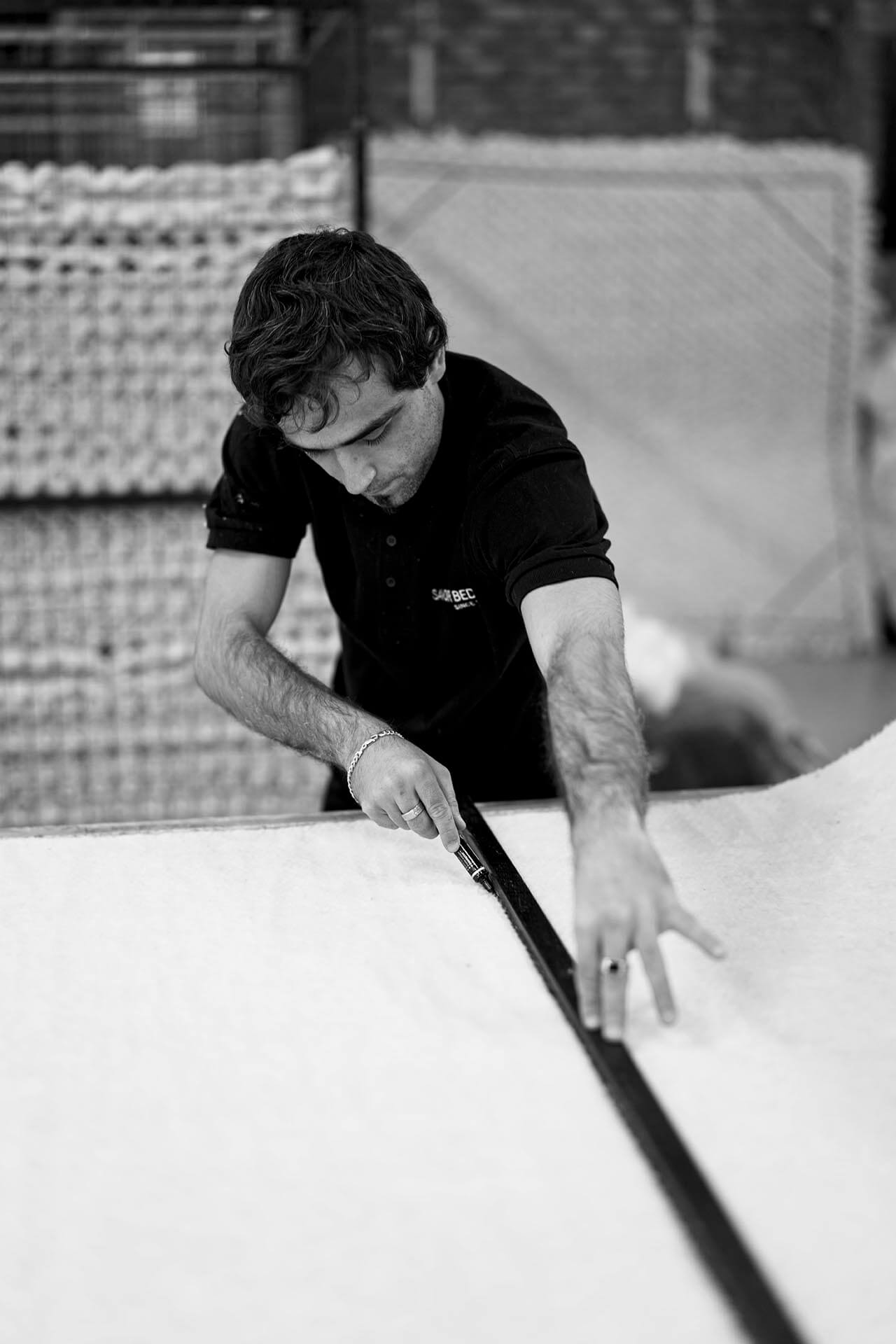 Craftsman measuring out the wool. Each of our beds is designed and handcrafted, not matter the size and finish. Sizes go right up to California king sized bed