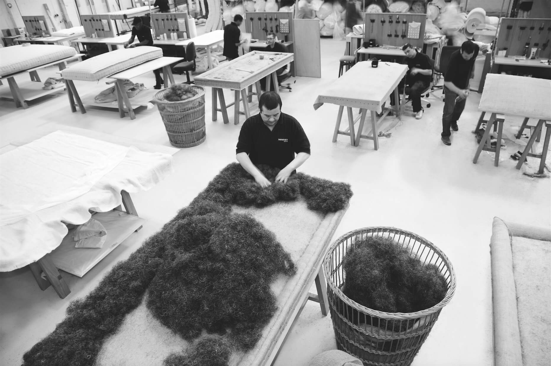 Image of a Savoir craftsman making a box spring base in the London Bedworks