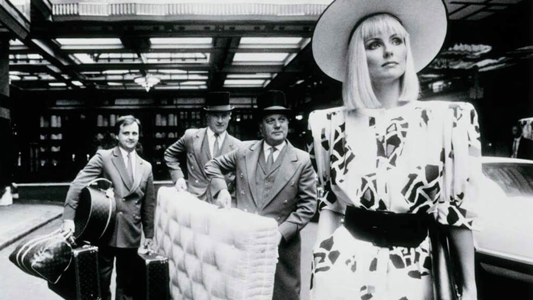 Image of Liza Minnelli with porters, leaving the Savoy Hotel in London with her Savoir mattress. Many celebrities are huge fans of our custom Savoy king sized beds and matresses