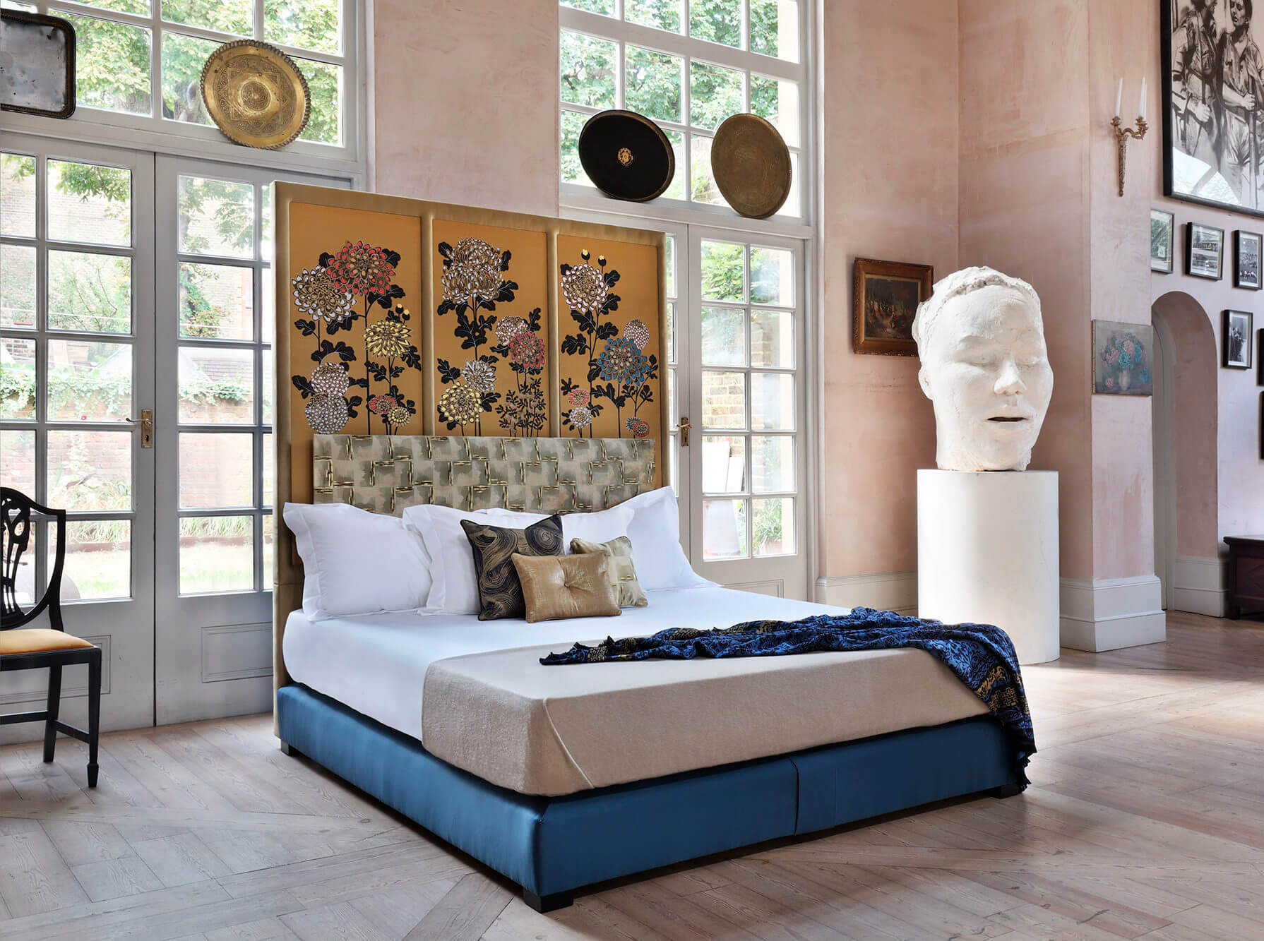 Picture of a bed with blue base and floral theme on the headboard, from Fromental Kiku bed - Savoir collaboration