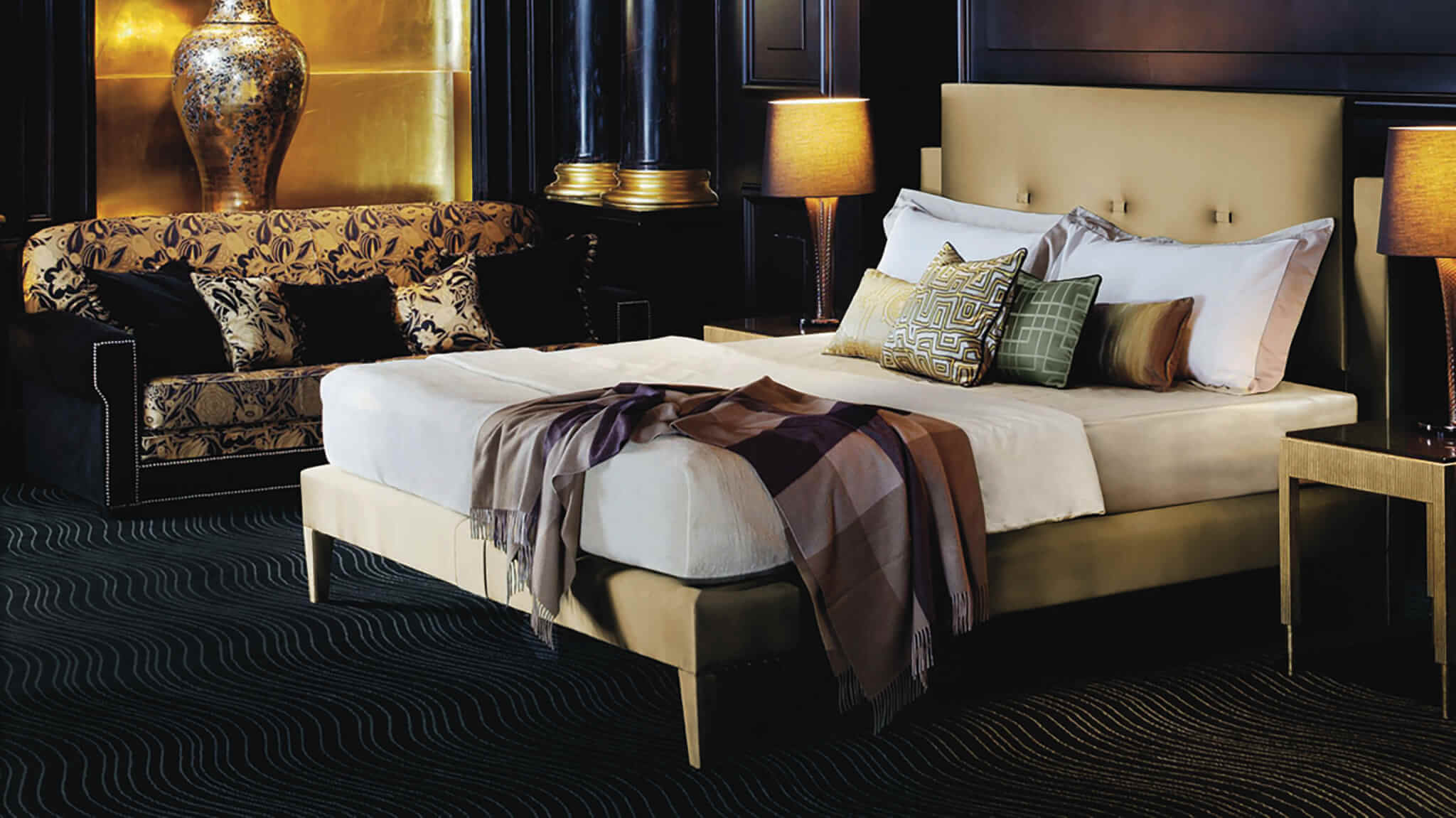 Savoy bed design in a gold satin fabric, photographed at The Savoy Hotel in London