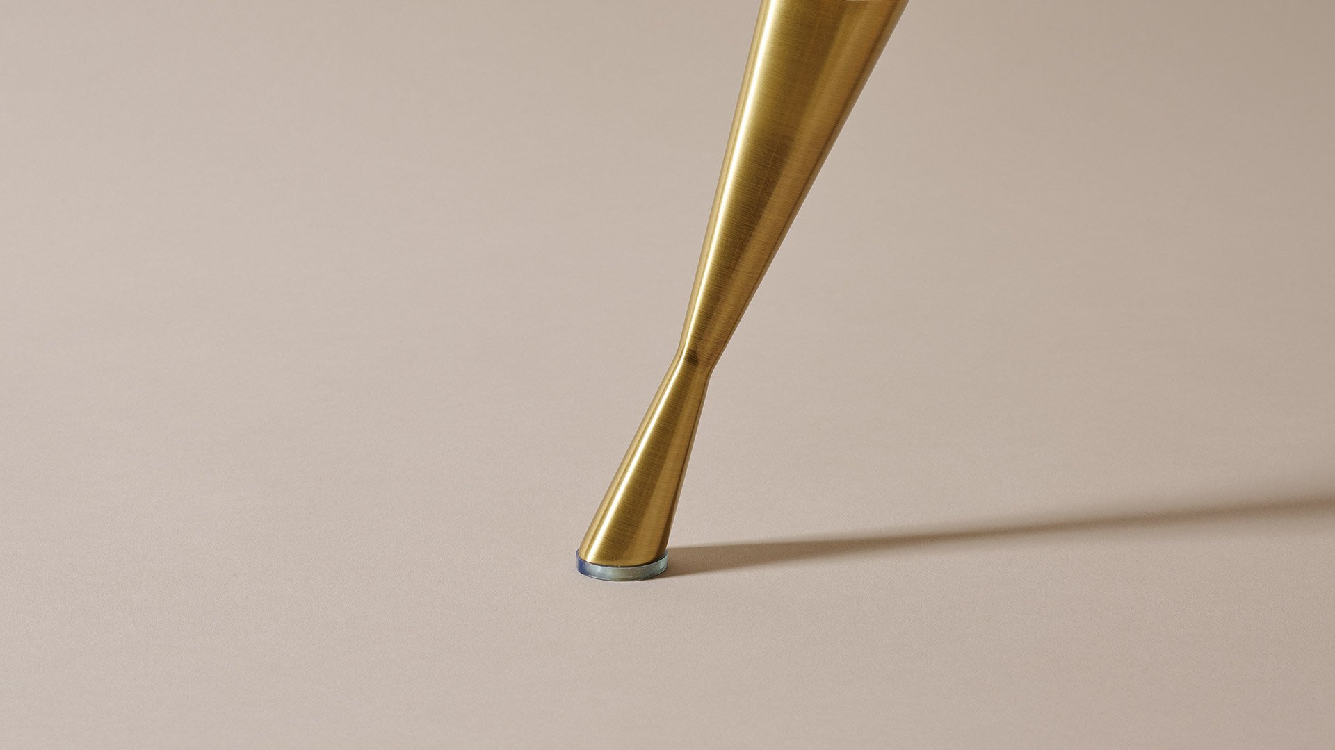 Slender 'Harlech' legs in subtle hourglass shape in shimmering gold finish