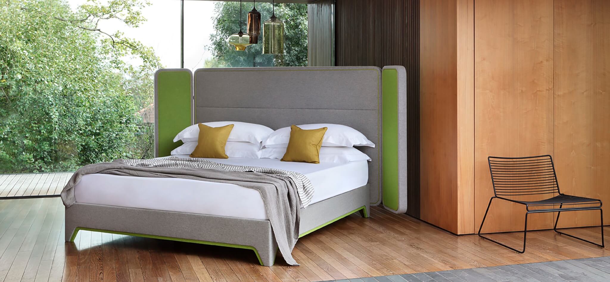 Steve Leung bed design in light grey and green wool fabrics, photographed in a mid century home in London