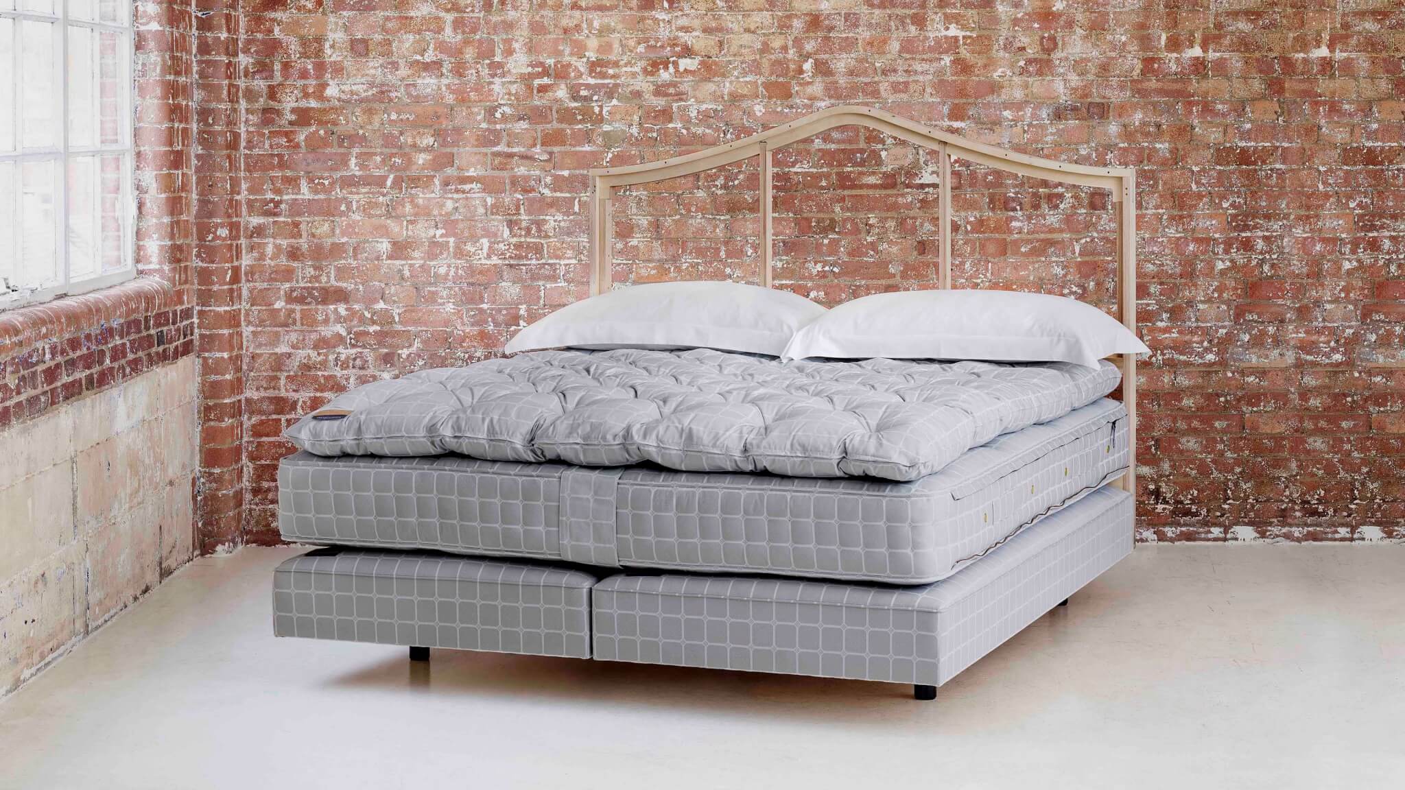 Image of a No 3. bed set with a tripped back headboard and no bedding on to display the quality of our luxury bed frames