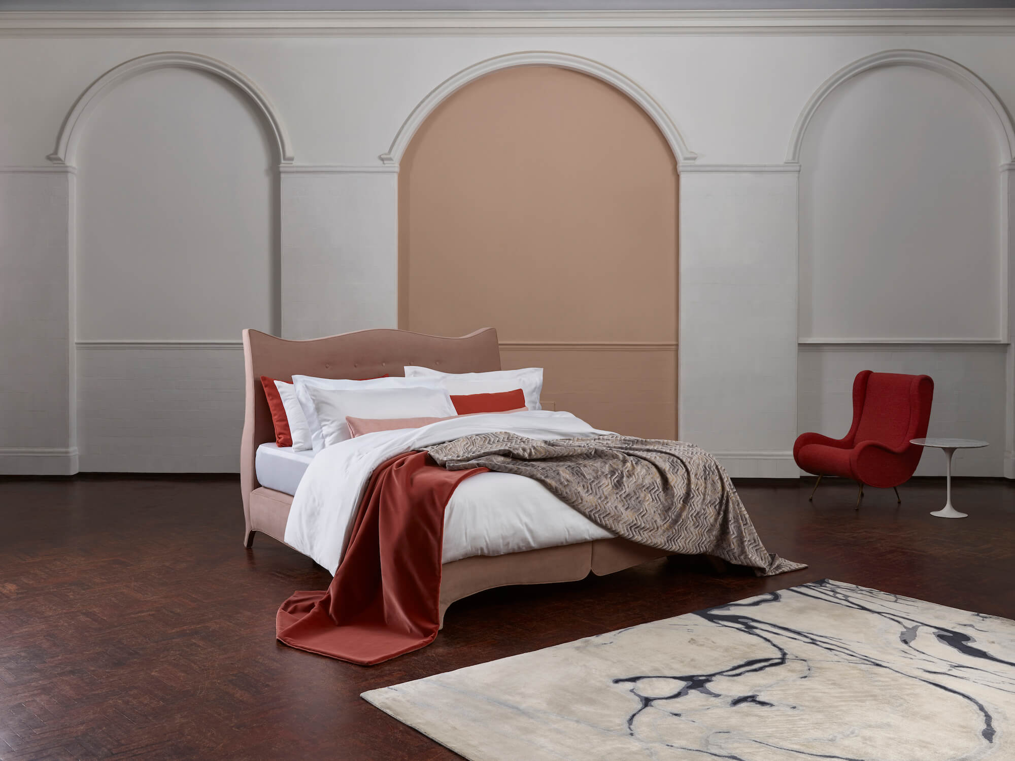 The Penelope bed adorned by the Drift linen collection