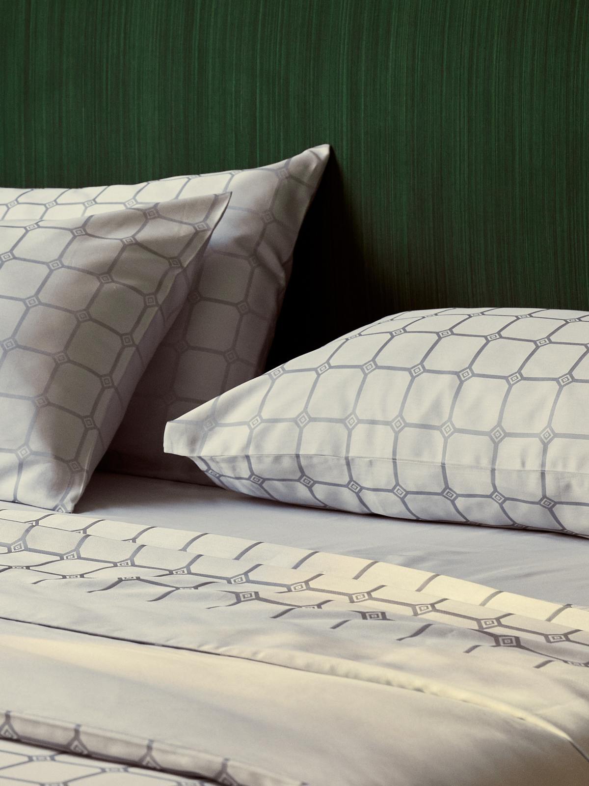 Close-up image of the Trellis bed linen collection in silver, featuring modern Cambridge finish