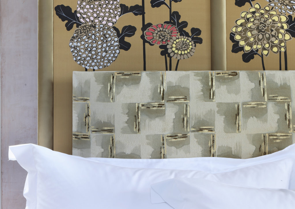 Savoir Kiku Bed's headboard with floral details and pillows