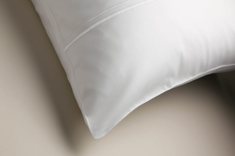 Corner detail of a sateen pillowcase