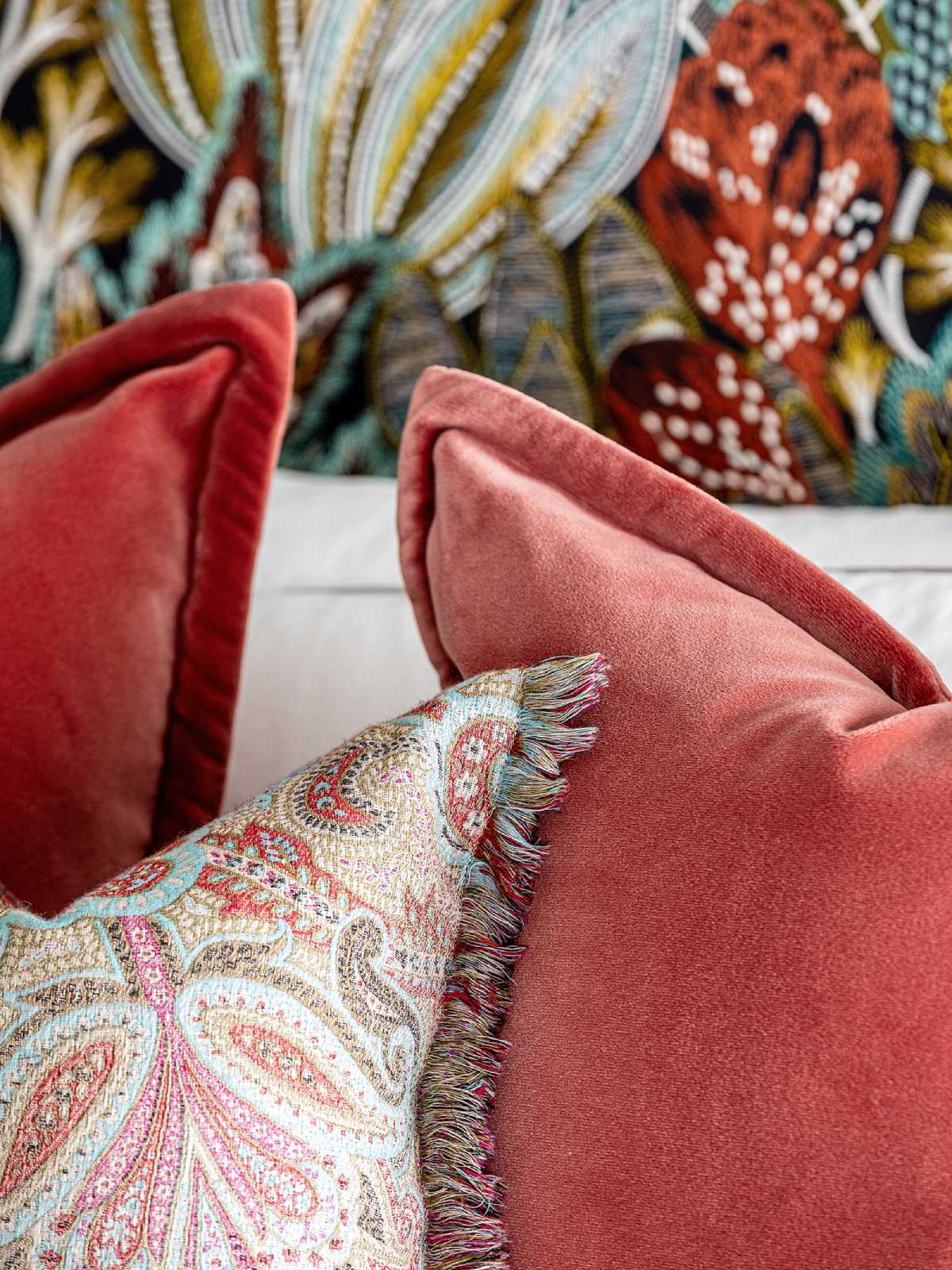 Red cushions on the Claudia design by Angel O'Donnell.